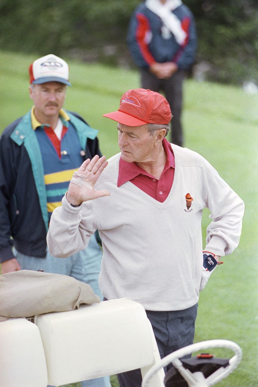 President George H.W. Bush on a golf coarse. 