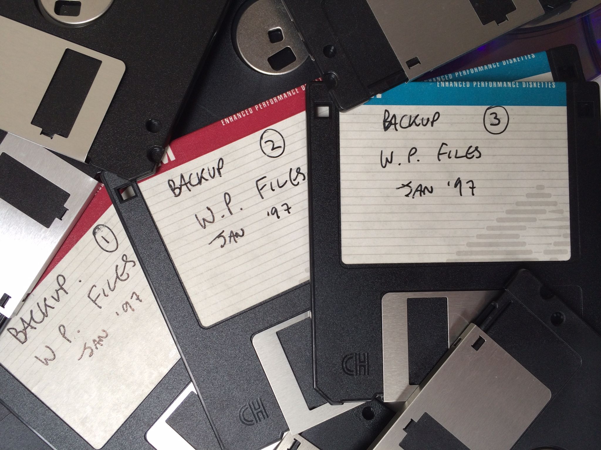 Pile of discarded old floppy discs used for backup