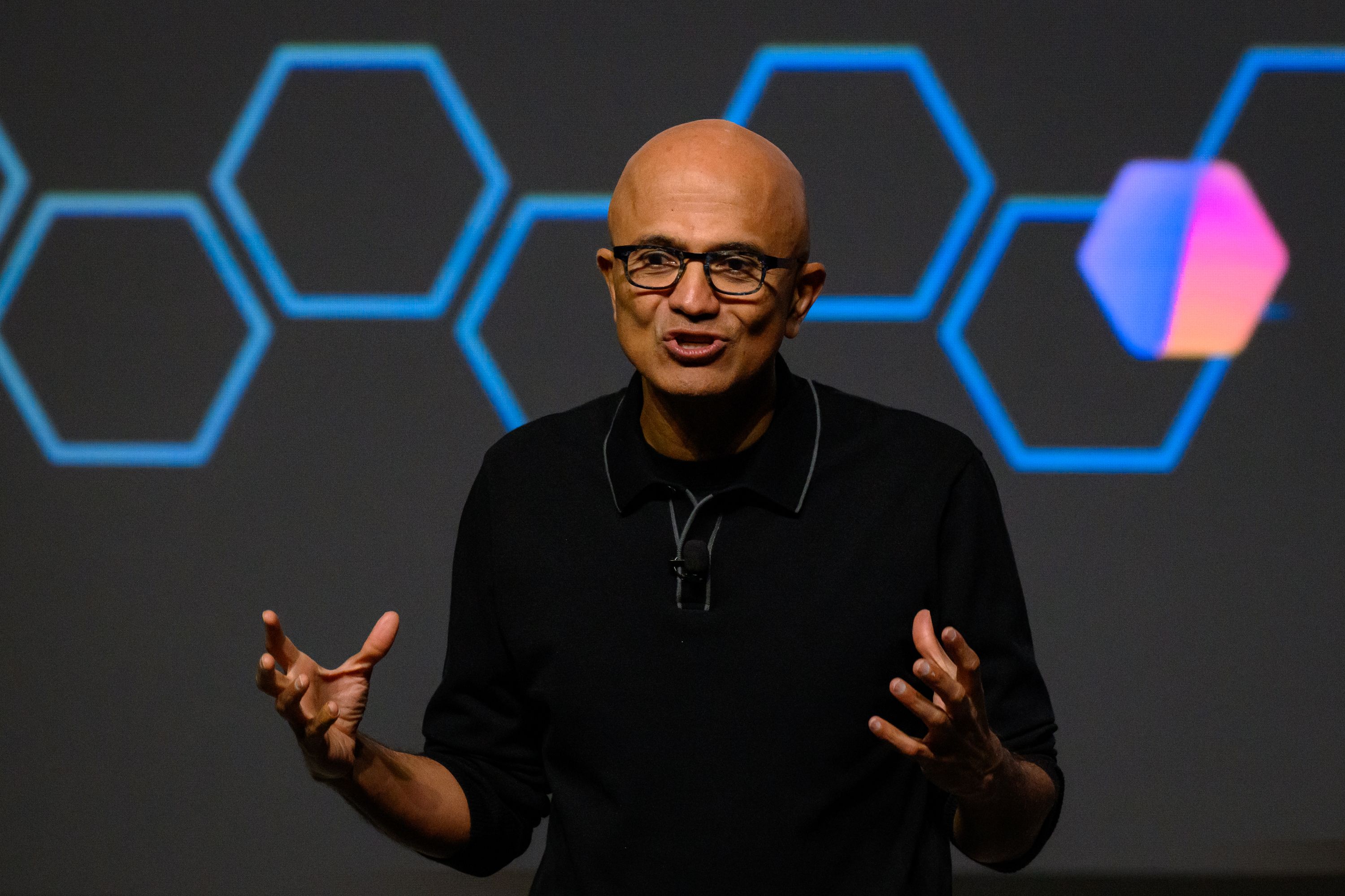 Chairman and CEO of Microsoft Satya Nadella speaks on stage during the Microsoft AI Tour at TikTok Entertainment Centre on April 23, 2026 in Sydney, Australia. Nadella, making his first visit to Australia since 2019, addressed business leaders, developers, and government representatives at the Micro