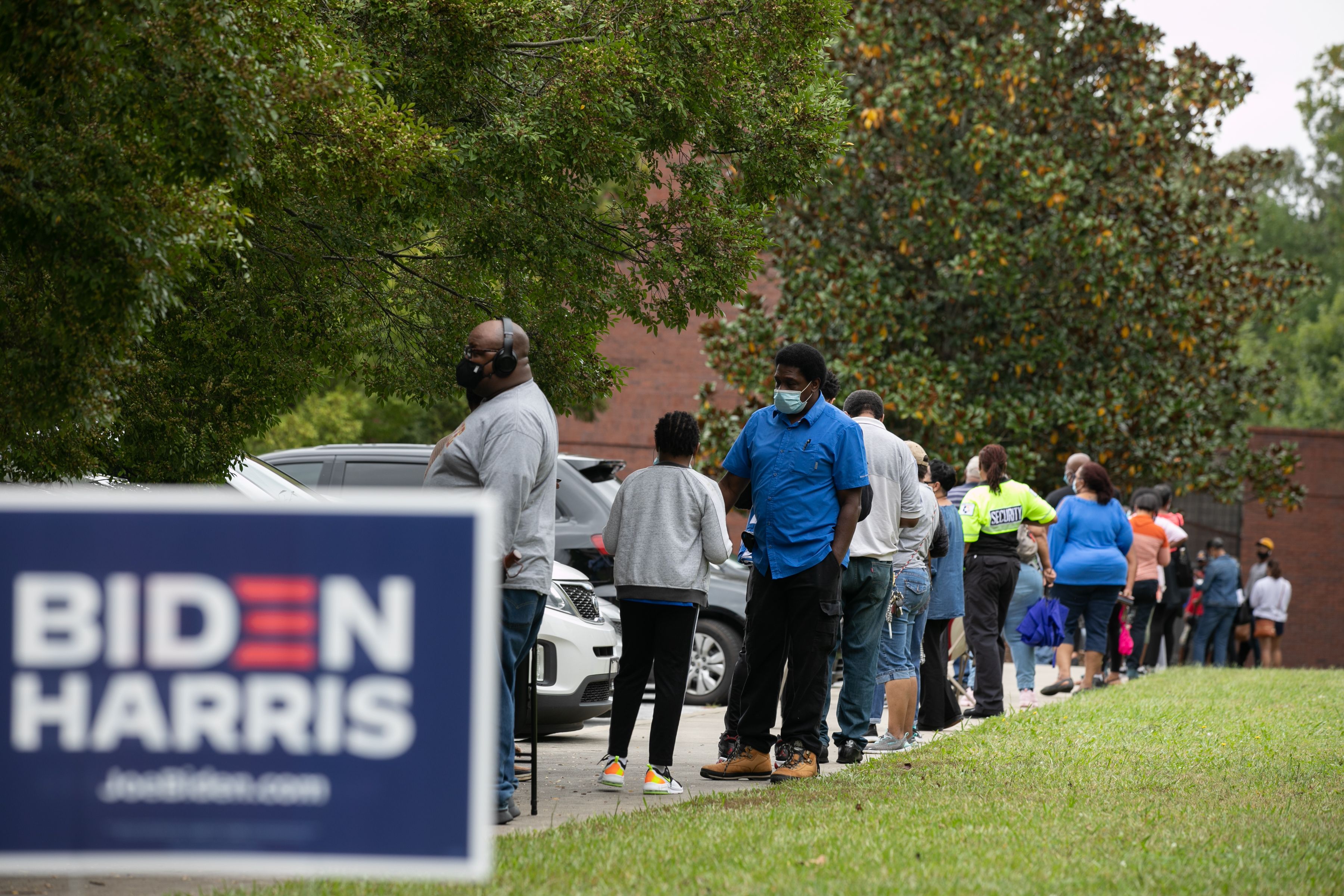People stand in line on the first day of early voting for the general election at the C.T. Martin Natatorium and Recreation Center on October 12, 2020 in Atlanta, Georgia.