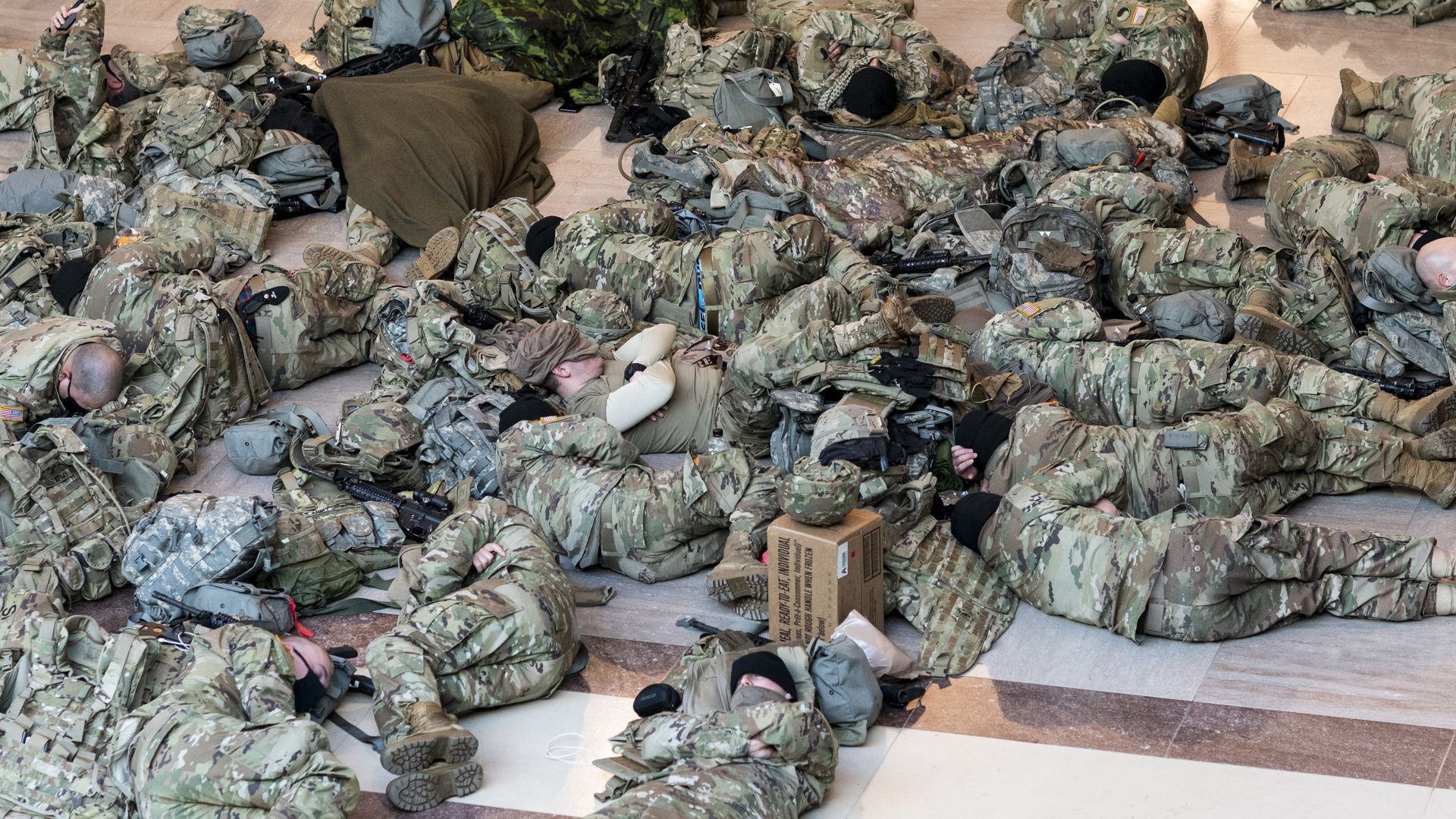 Soldiers sleeping in the Capitol building.