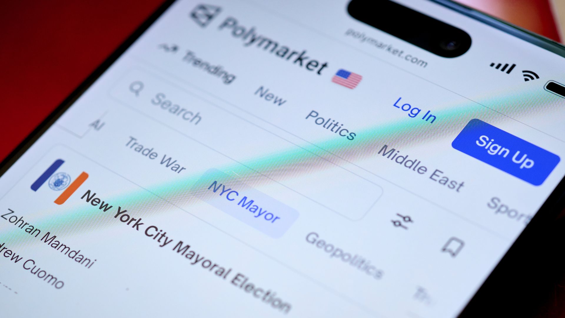 A website known as Polymarket on display on a smartphone
