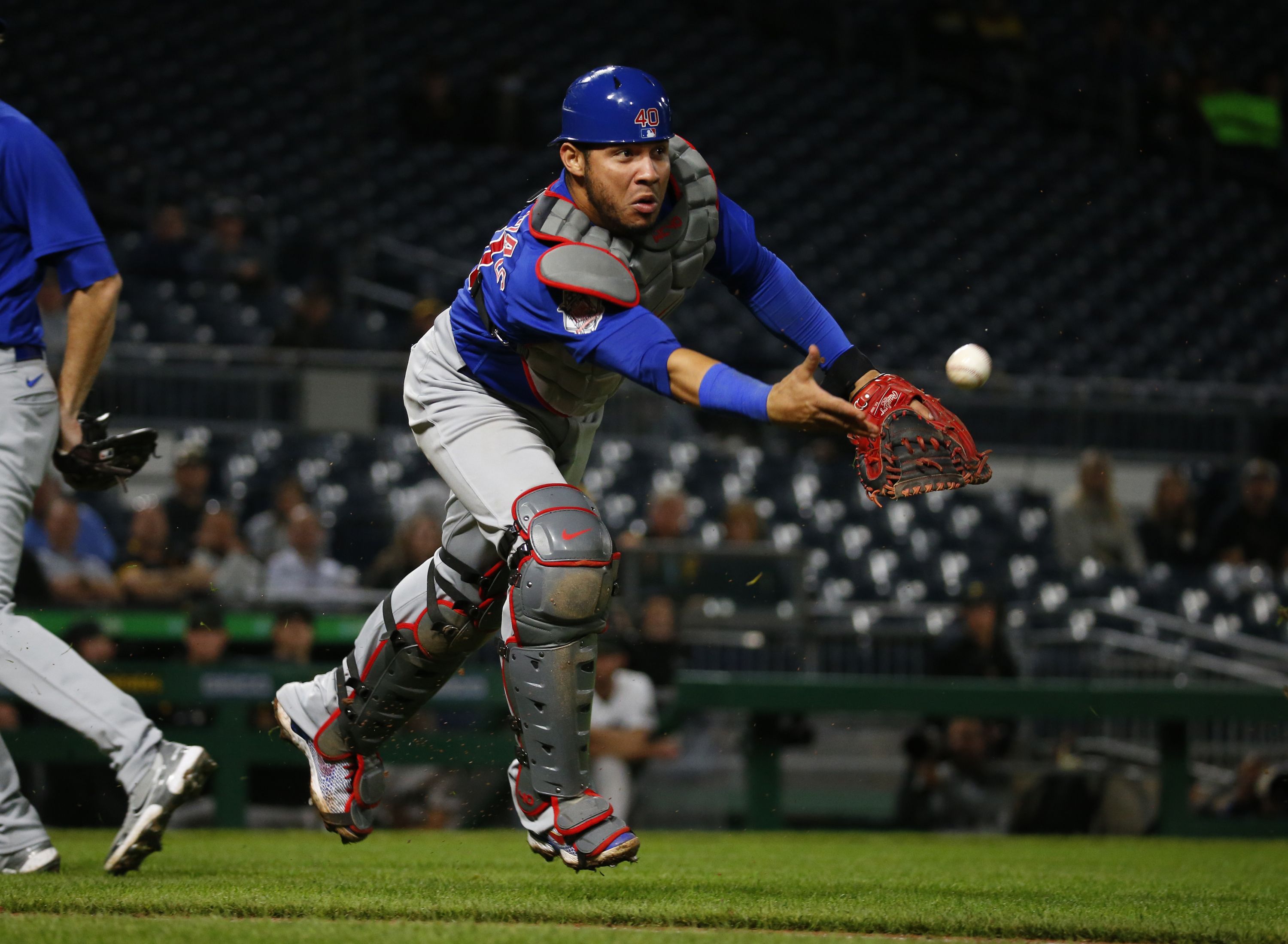 Photo of a baseball player making a catch on the field. 