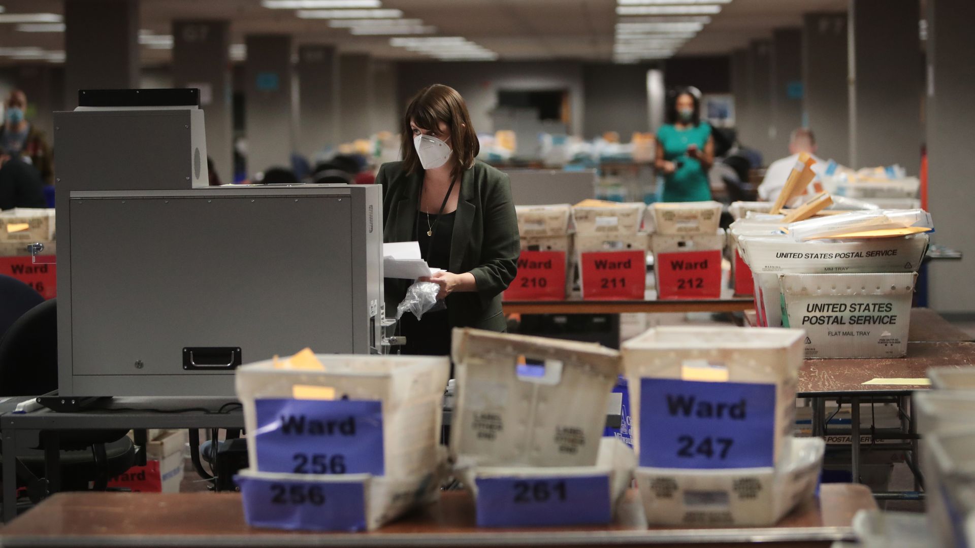 Claire Woodall-Vogg, executive director of the Milwaukee election commission collects the count from absentee ballots from a voting machine on November 04, 2020 in Milwaukee, Wisconsin.