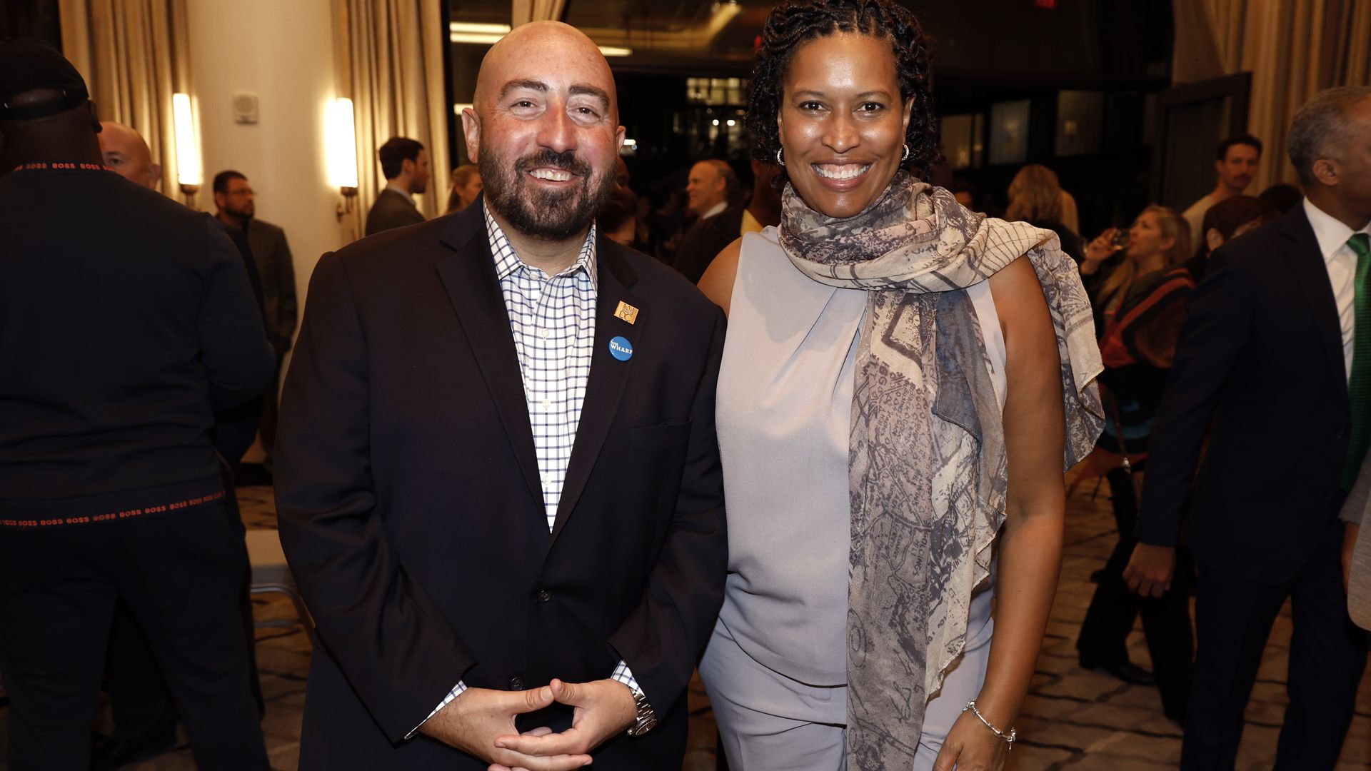 John Falcicchio alongside Muriel Bowser