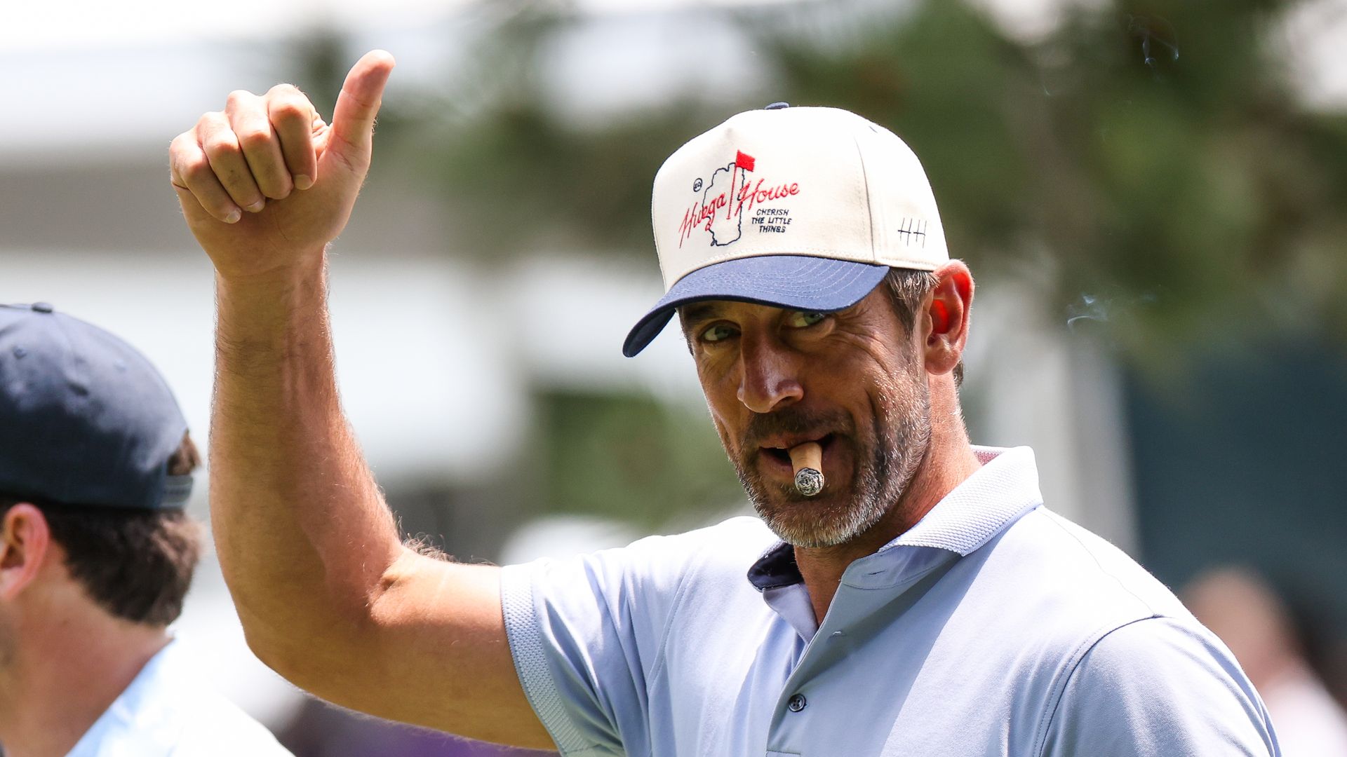 NFL football player Aaron Rodgers gives a thumbs up to the crowd at the 15th hole on day one of the 2024 American Century Championship at Edgewood Tahoe Golf Course on July 12, 2024 in Stateline, Nevada. (Photo by Isaiah Vazquez/Getty Images)
