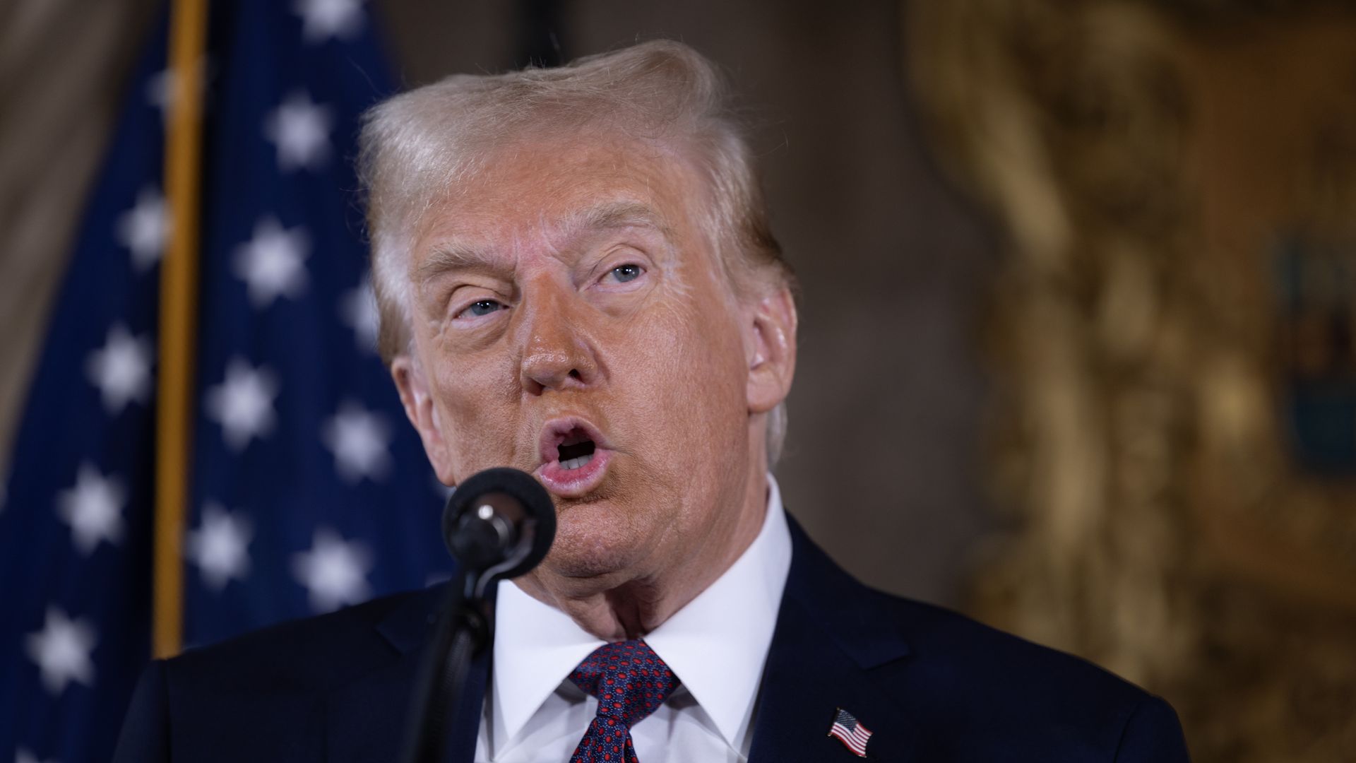 Donald Trump speaks to members of the media during a press conference at the Mar-a-Lago Club on January 0
