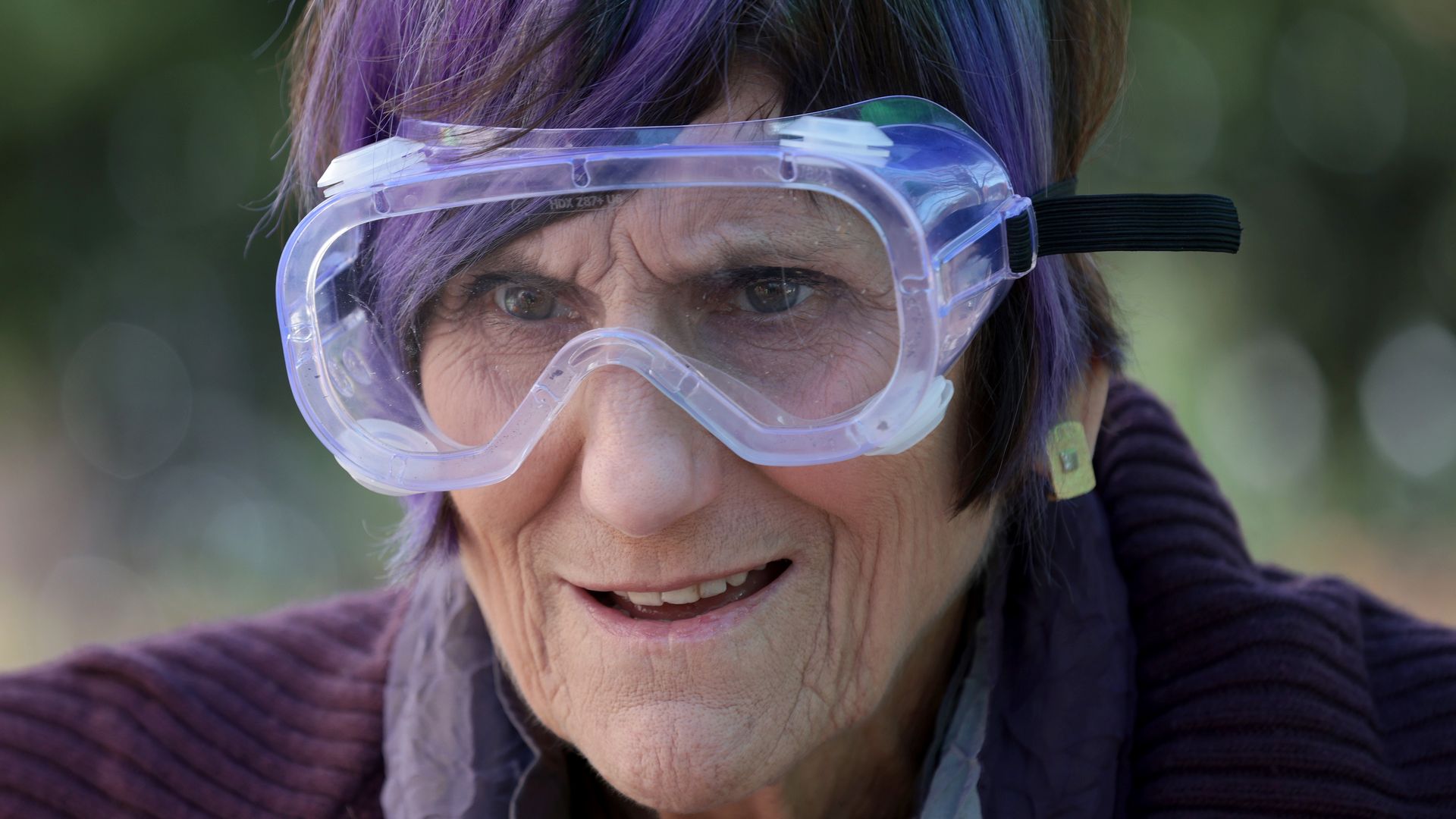 Rep. Rosa DeLauro is seen wearing goggles at an event to turn guns into garden implements.