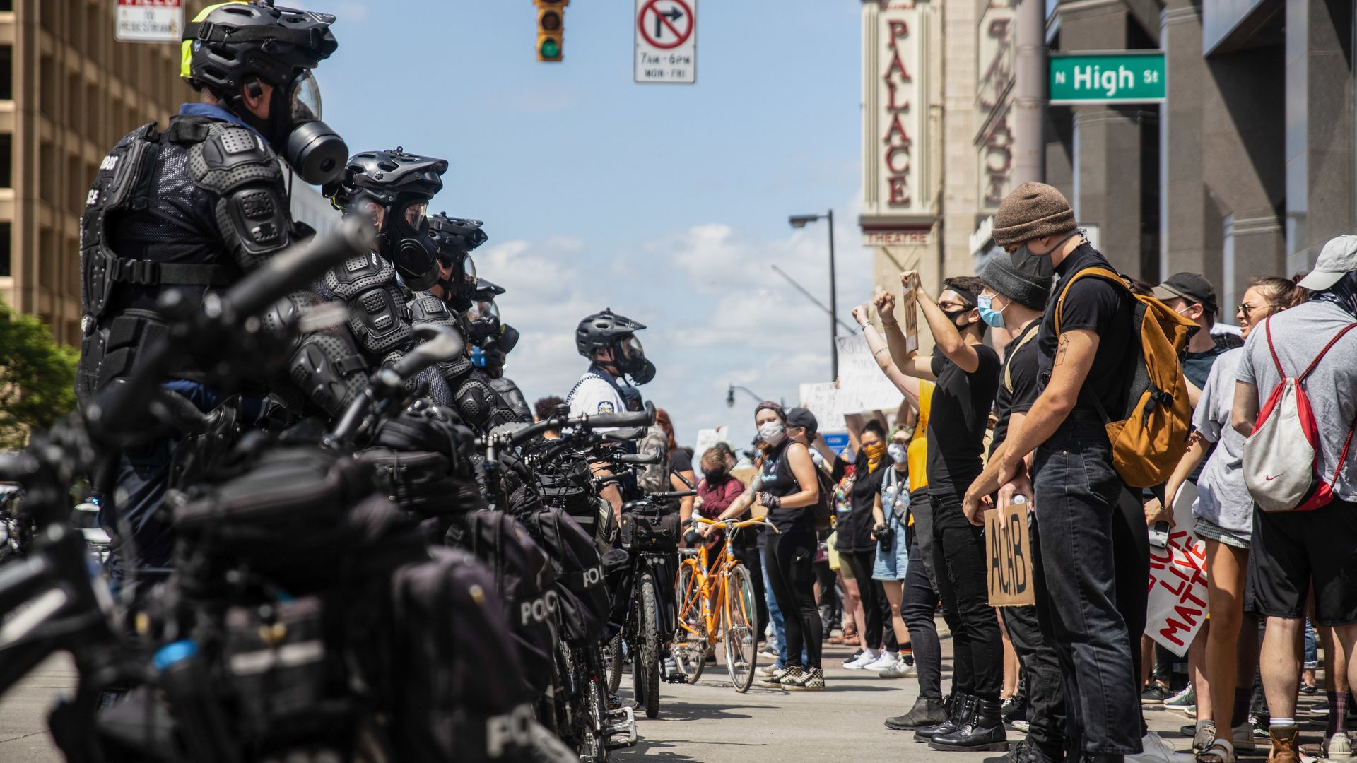 Police in riot gear patrol a Columbus protest in 2020.