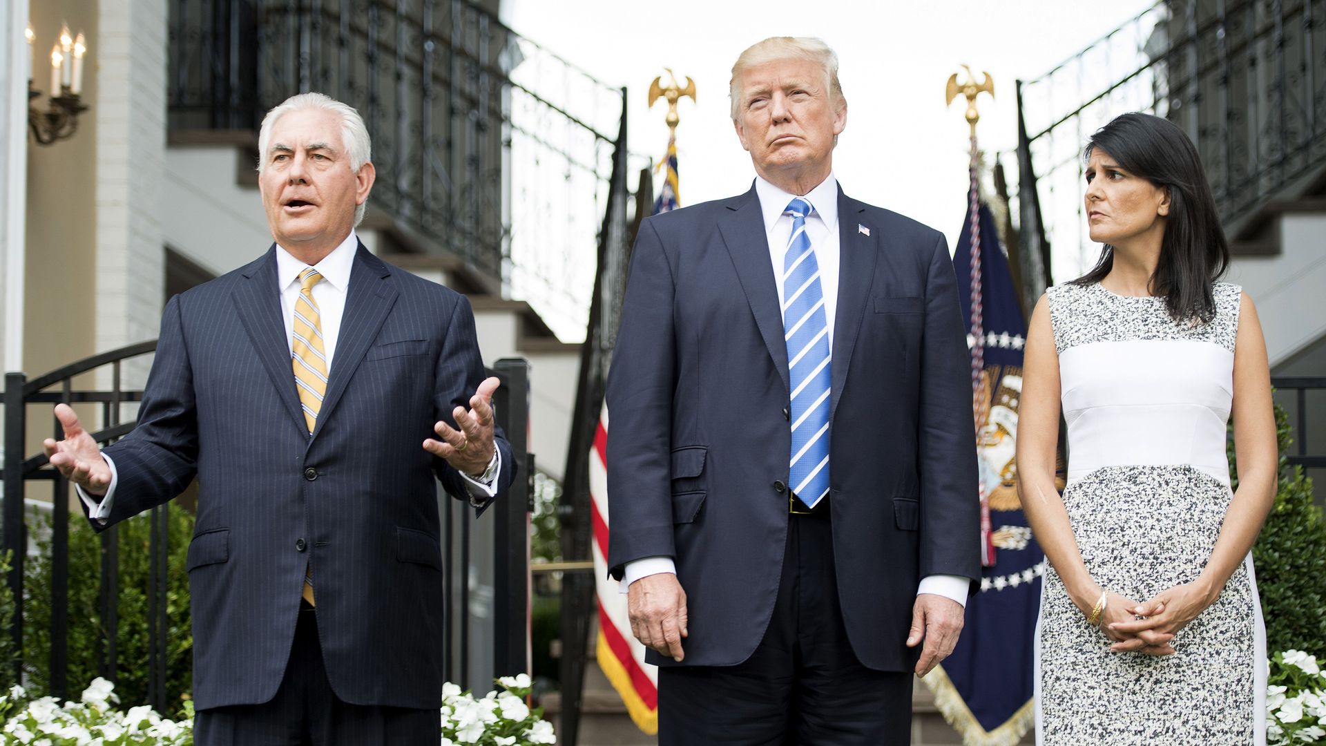 Secretary of State Rex Tillerson (L) speaks to the press with US President Donald Trump (C) and US Ambassador to the United Nations Nikki Haley (R) on August 11, 2017