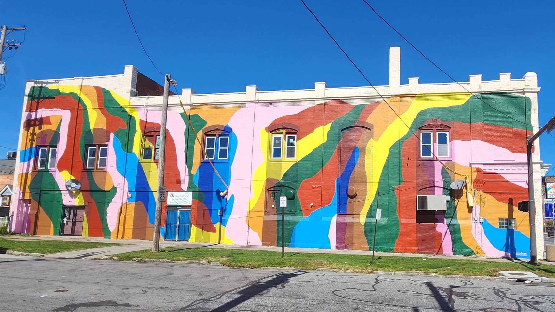 Abstract mural in Cleveland, with bright colors on a  two story building