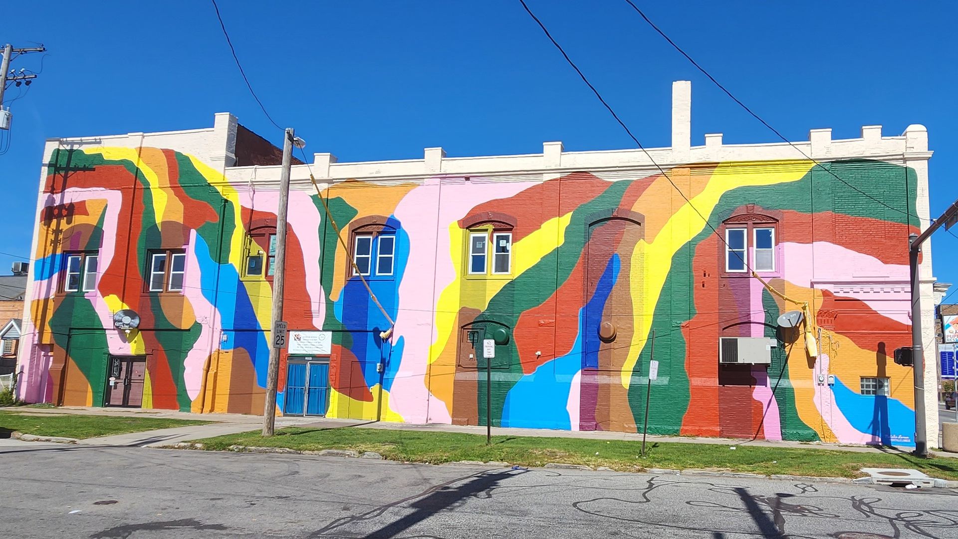 Abstract mural in Cleveland, with bright colors on a two story building