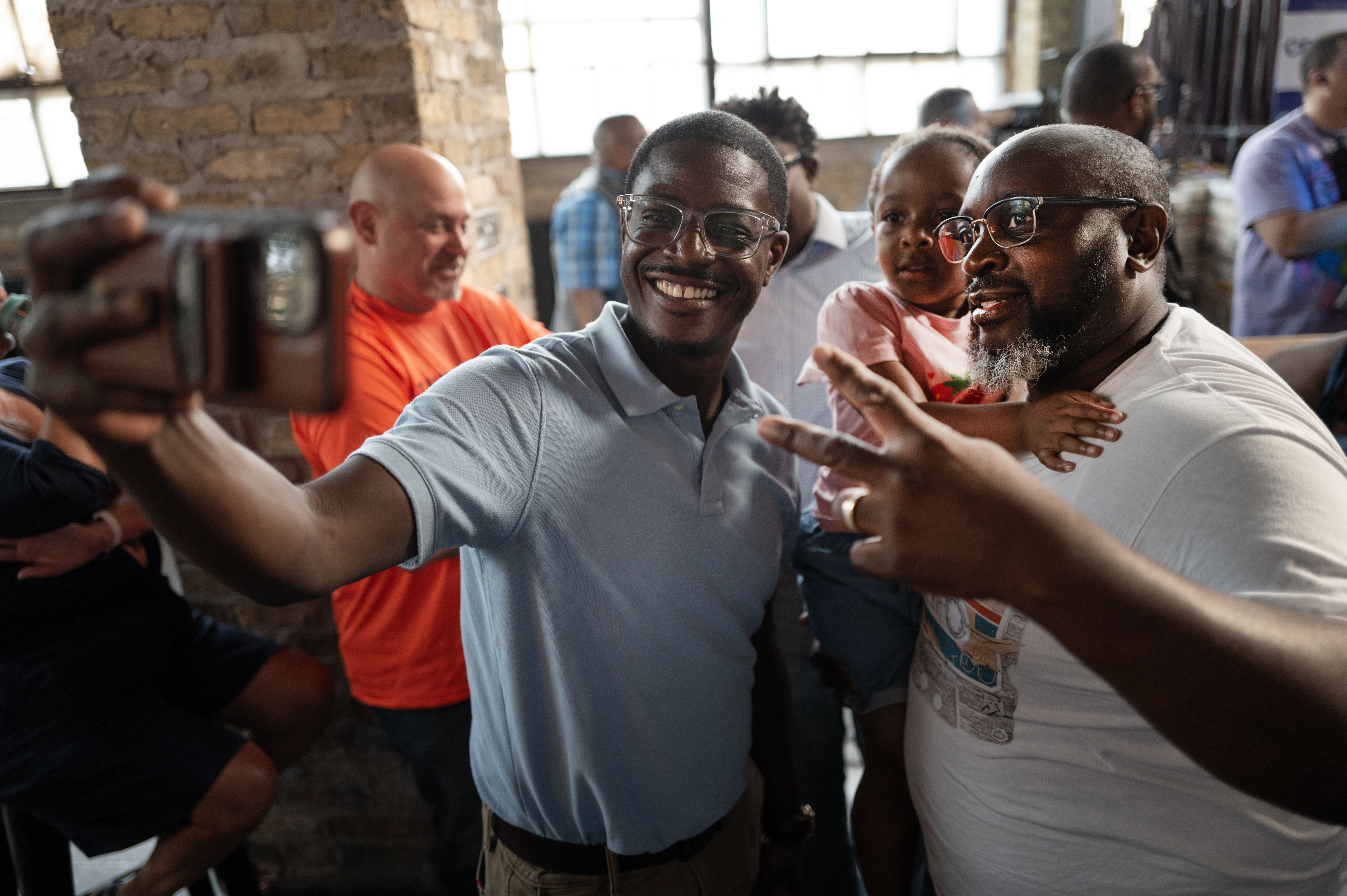 Democratic Wisconsin gubernatorial candidate David Crowley (L) greets supporters at a campaign rally on August 10, 2026 in Milwaukee, Wisconsin. Crowley is polling second behind front-runner Francesca Hong in the Democratic primary, which takes place tomorrow. (Photo by Scott Olson/Getty Images)