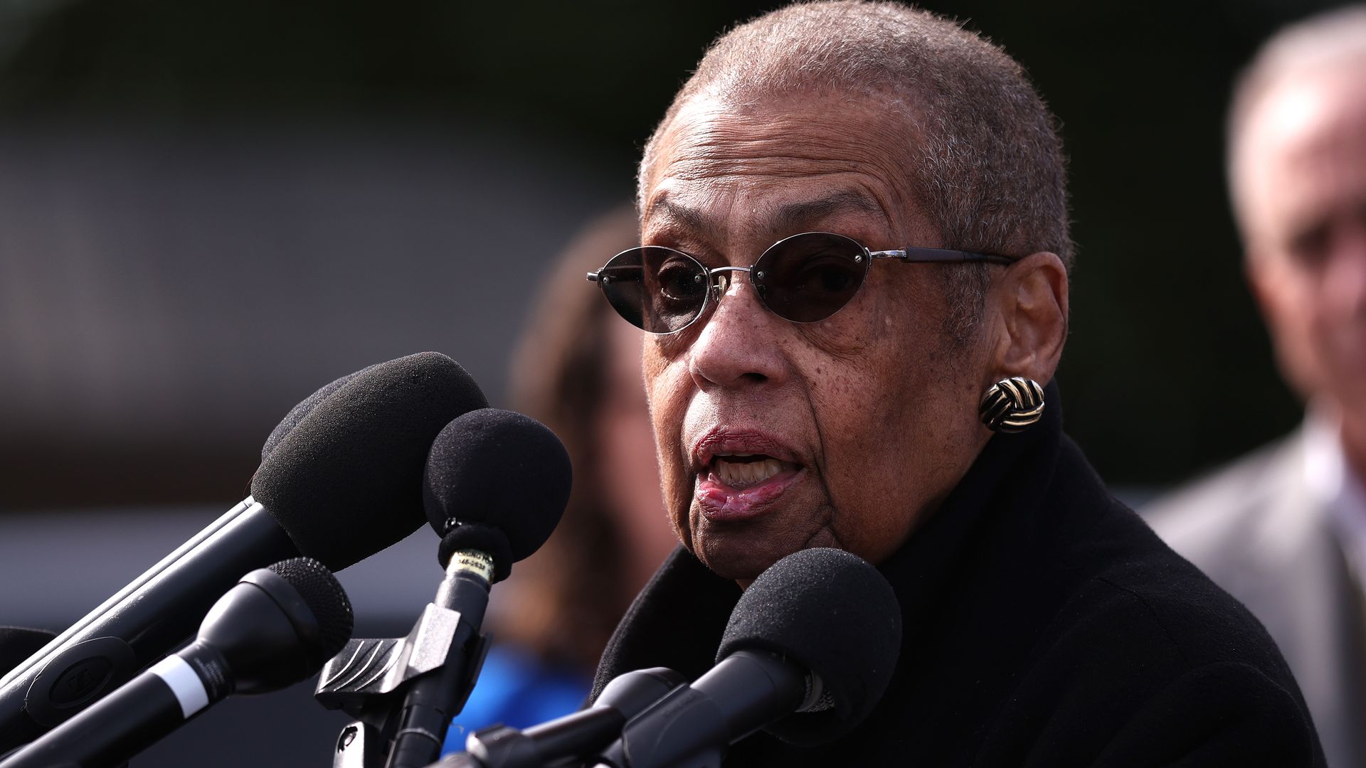 Eleanor Holmes Norton speaks in front of microphones 