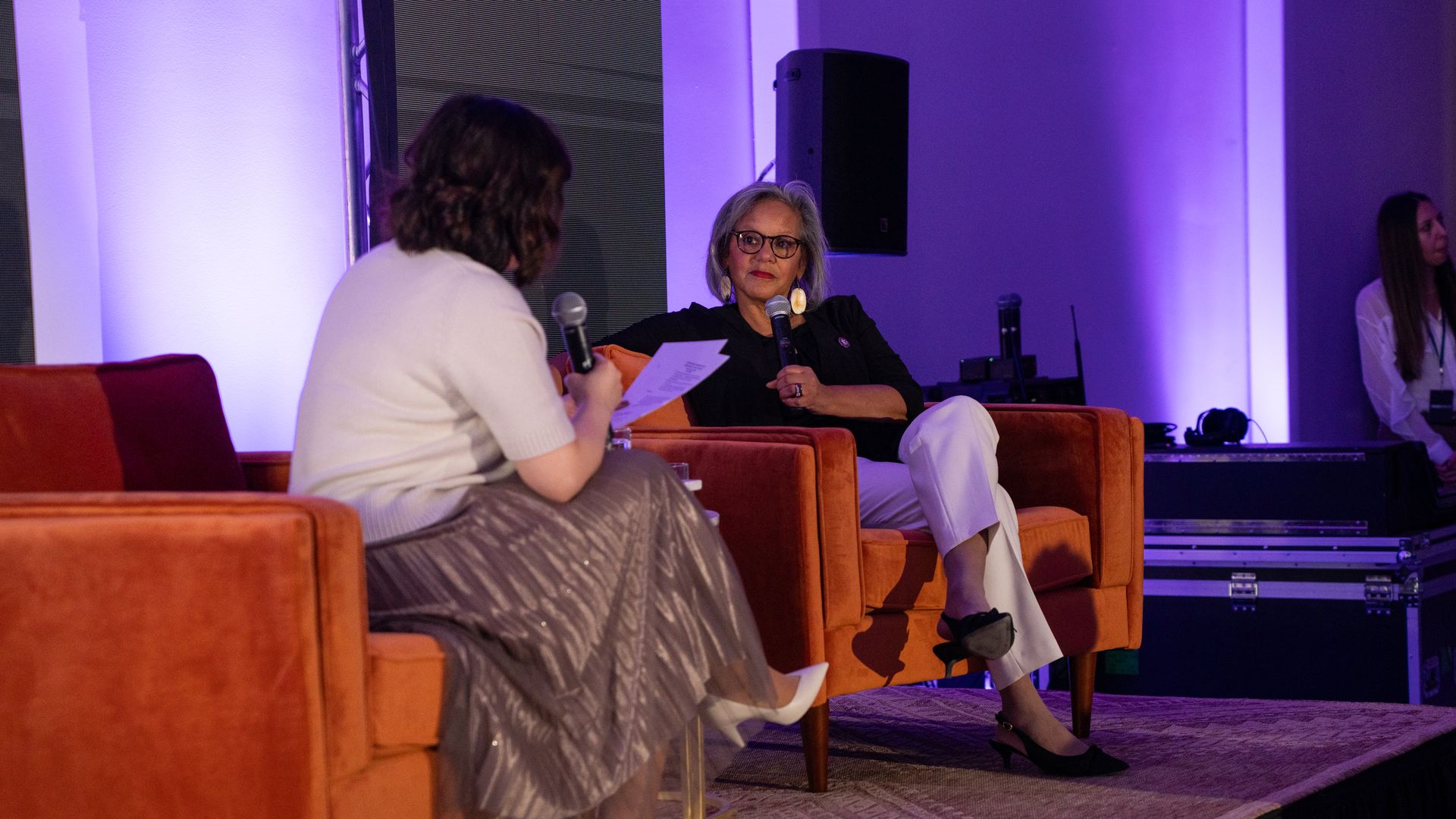 Hope King on stage with Rep. Robin Kelly. Credit: Cori Baker on behalf of Axios.