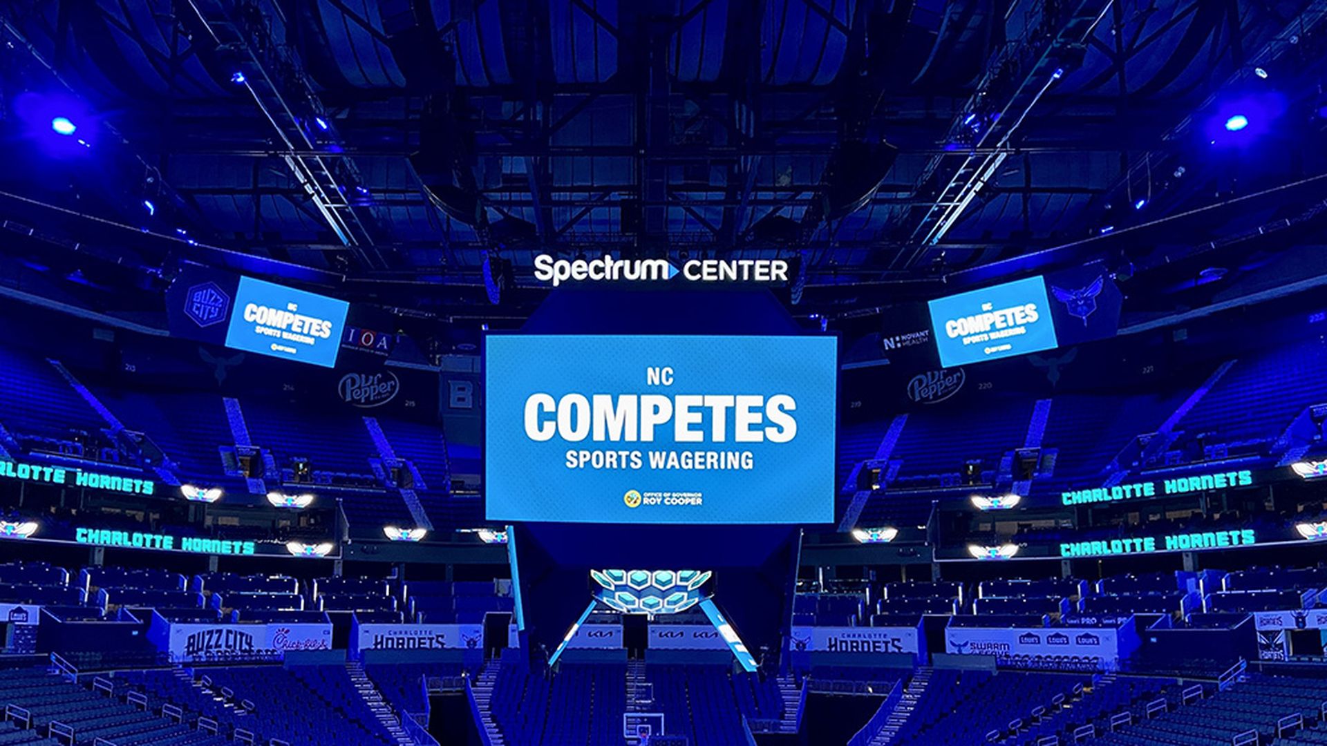 "NC Competes sports wagering" sign on the video boards at Spectrum Center in Uptown. Photo: Ashley Mahoney/Axios