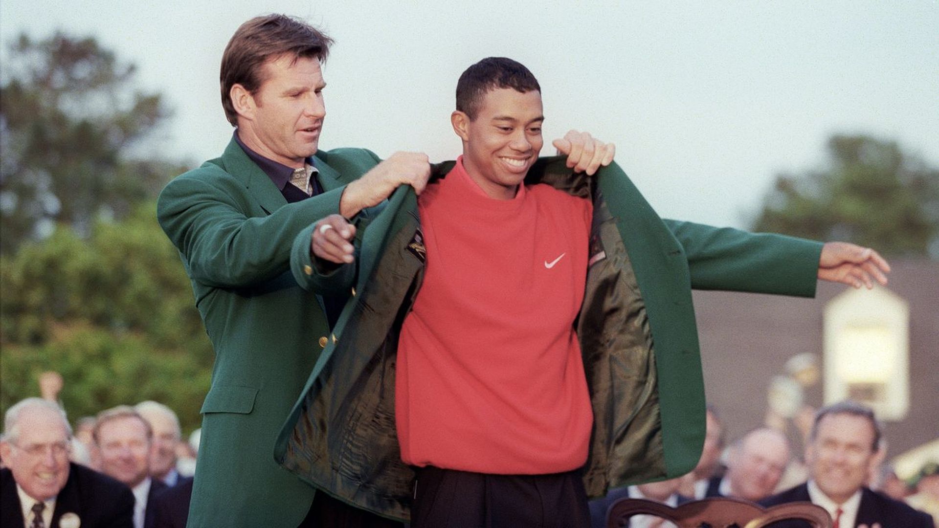 Tiger getting the Masters jacket in 1996