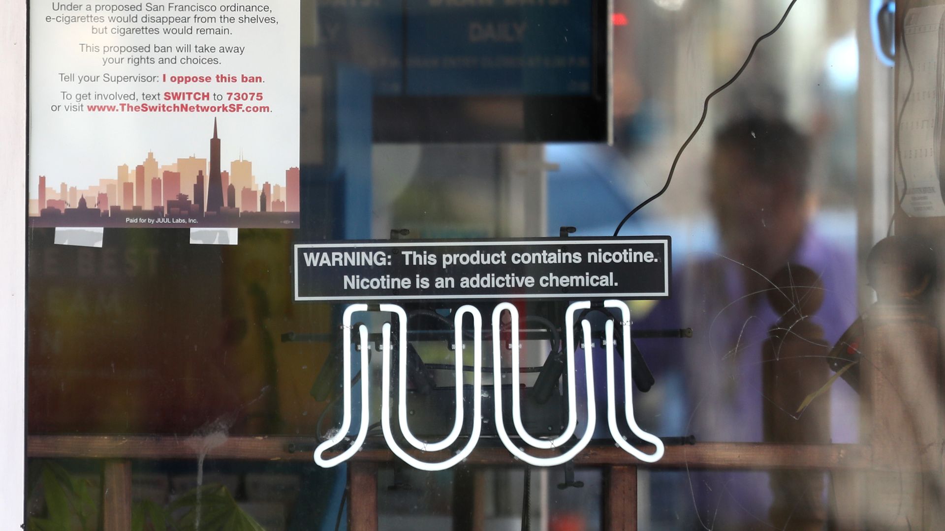 A neon sign advertising Juul e-cigarettes.