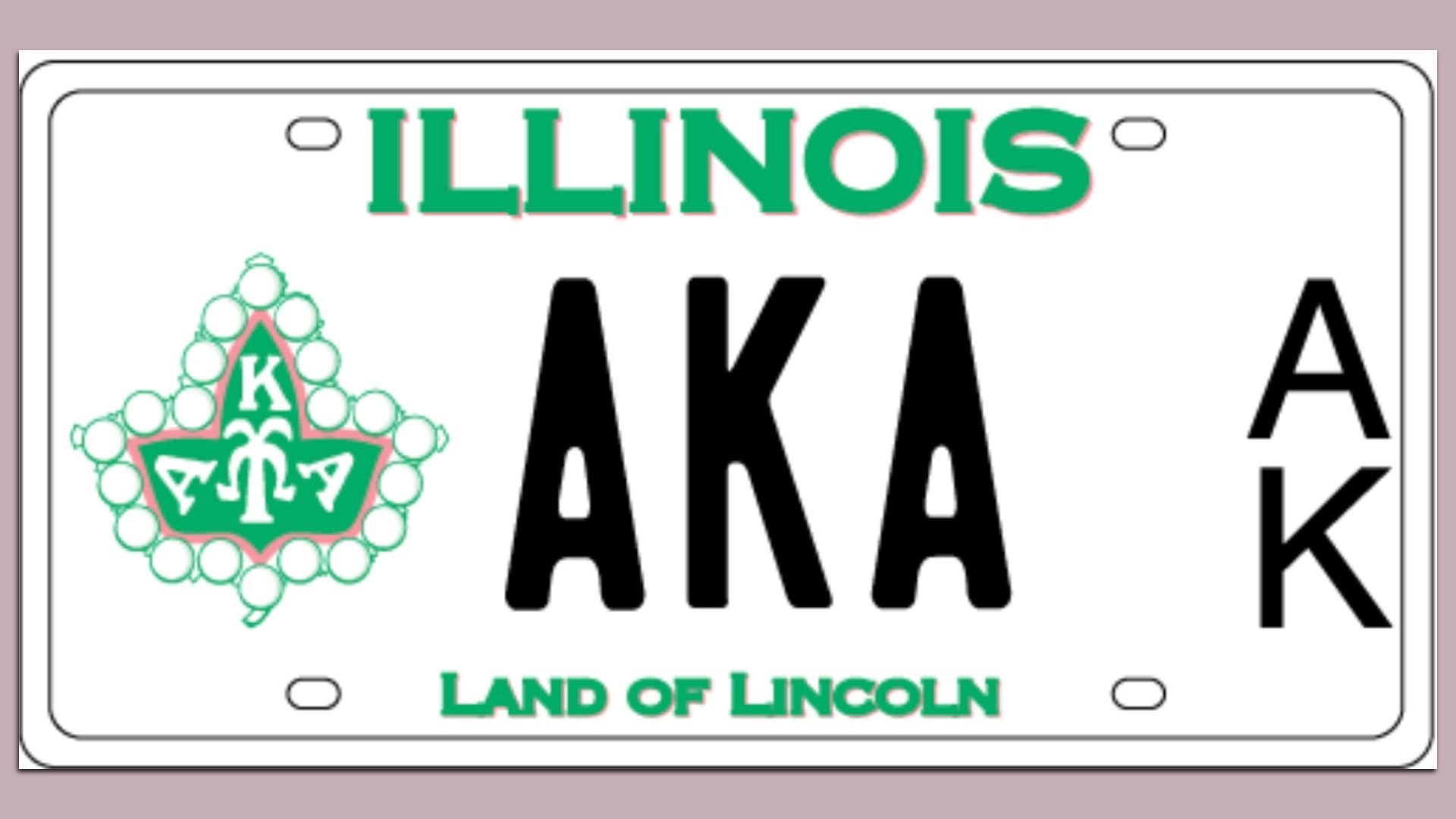 Illinois license plate with green text reading ILLINOIS and LAND OF LINCOLN, featuring a green and pink emblem with letters K, A, A, and black letters AKA in the center and right.