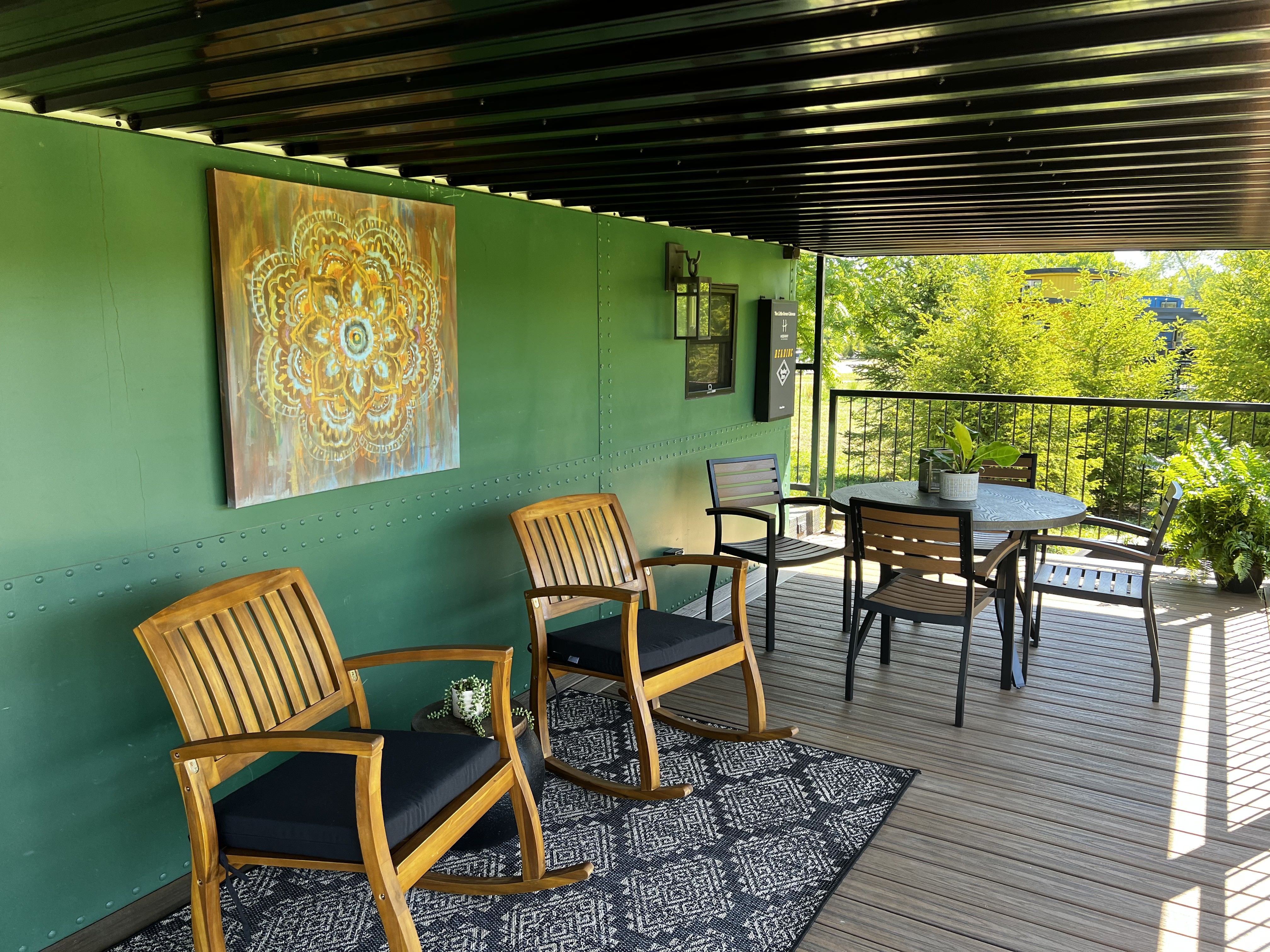 Porch of a red cabin. 