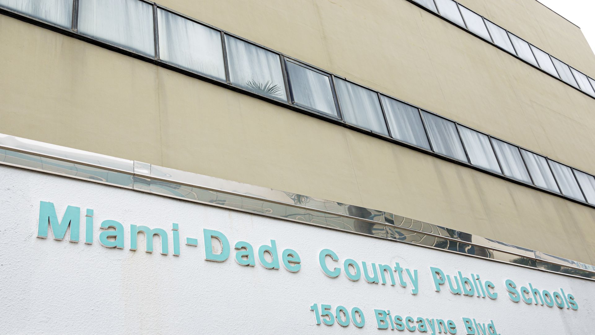 Image of the front of the Miami-Dade County Public School building. 