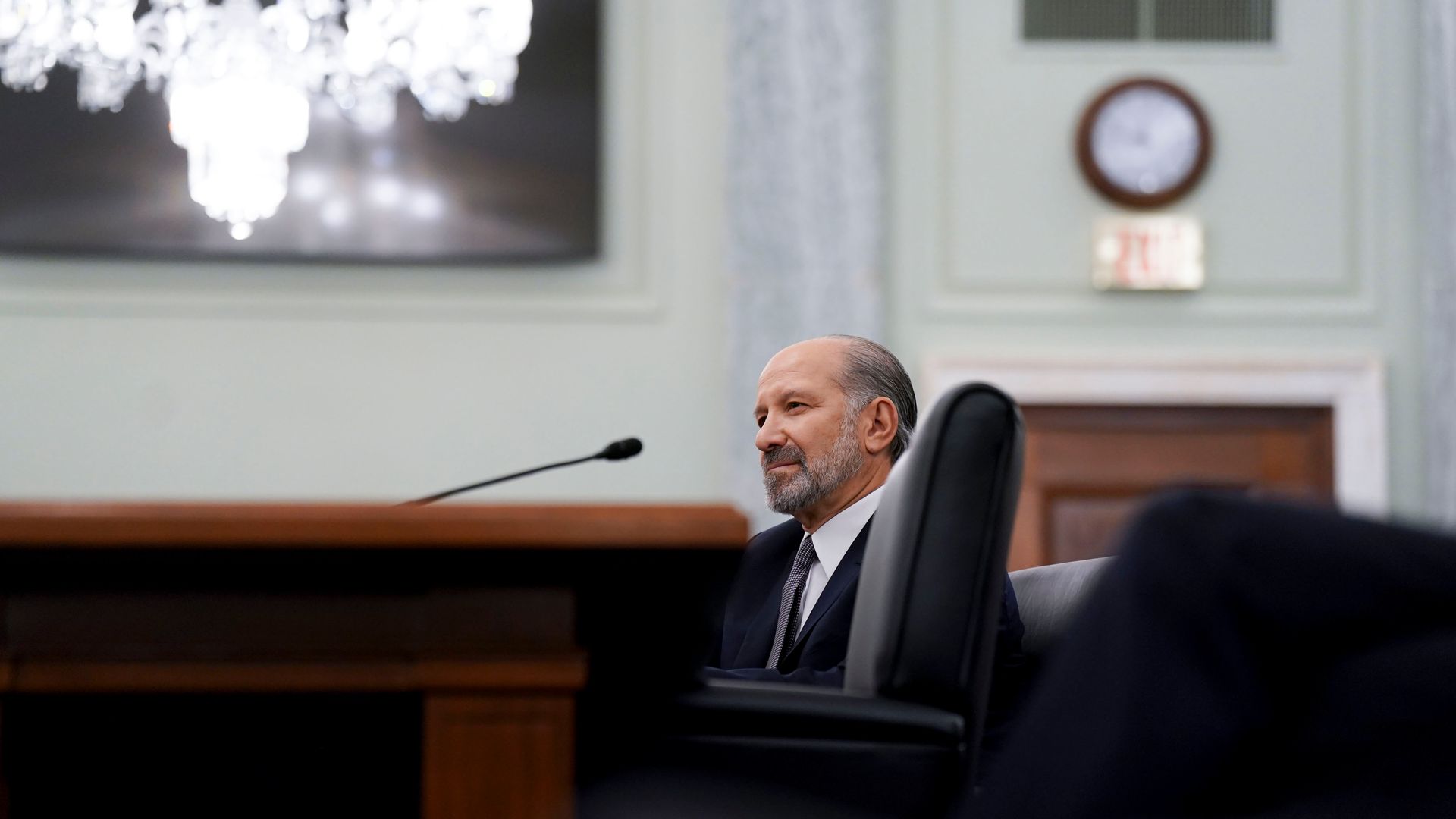 Howard Lutnick, President Trump's nominee for Commerce Secretary, sits at a table during his confirmation hearing on Jan. 29.