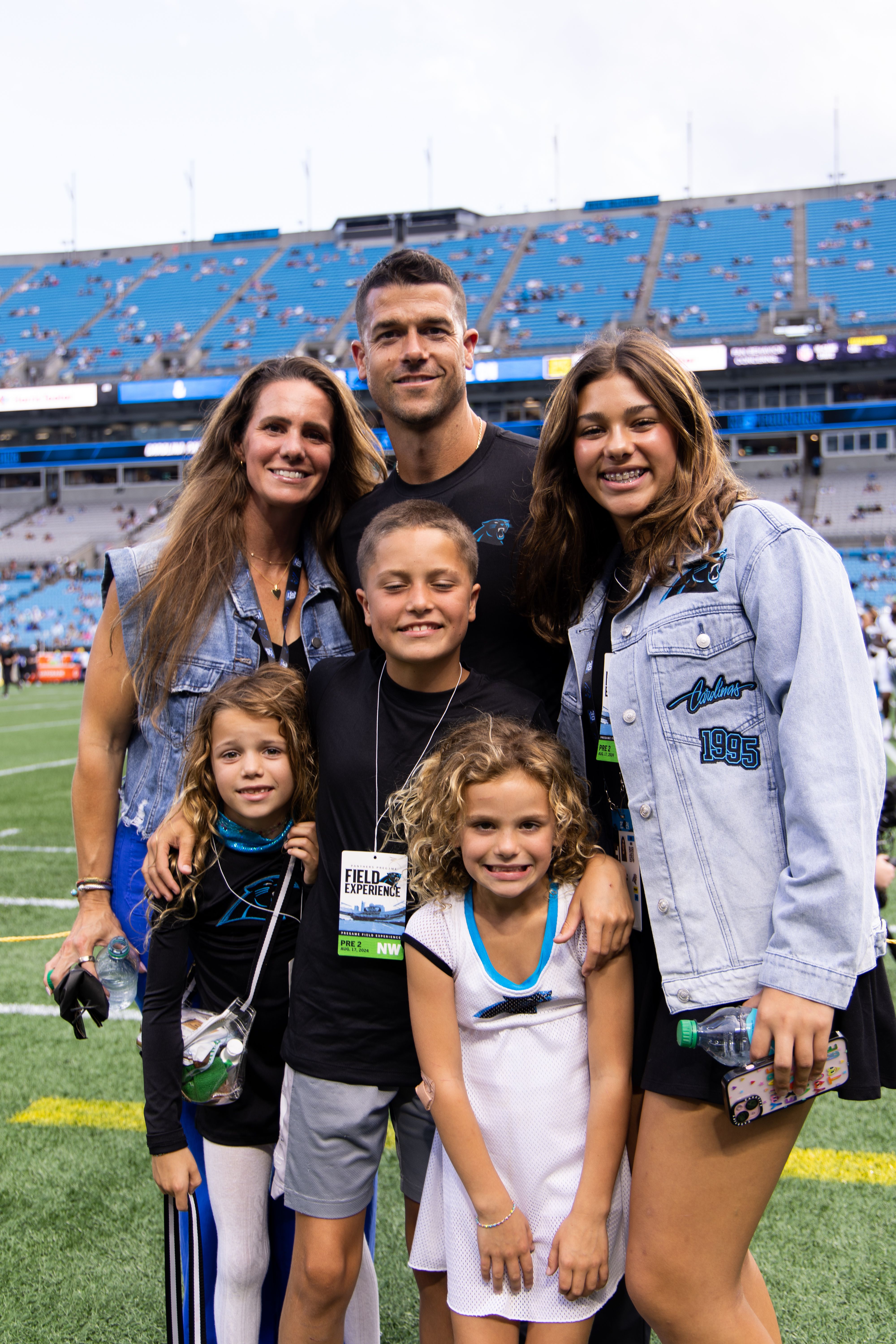 Dave Canales, head coach of the Carolina Panthers, poses for a picture with his family before a preseason game against the New York Jets at Bank of America Stadium on August 17, 2024 in Charlotte, North Carolina. (Kara Durrette/Getty Images)