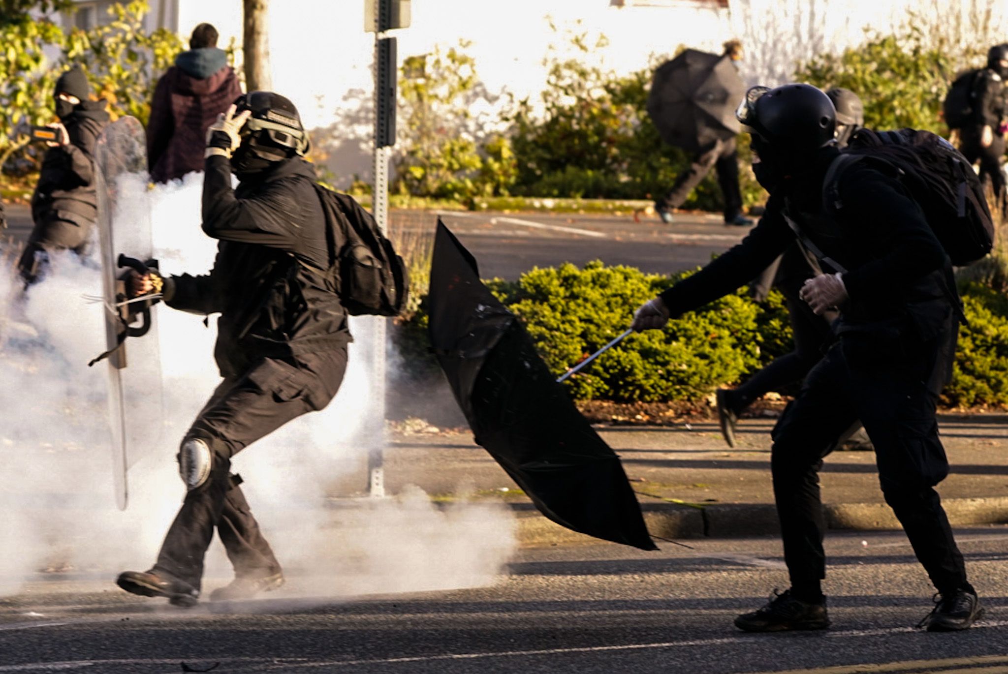 Anti-fascist protesters dodge police munitions during political clashes on December 12, 2020 in Olympia, Washington.