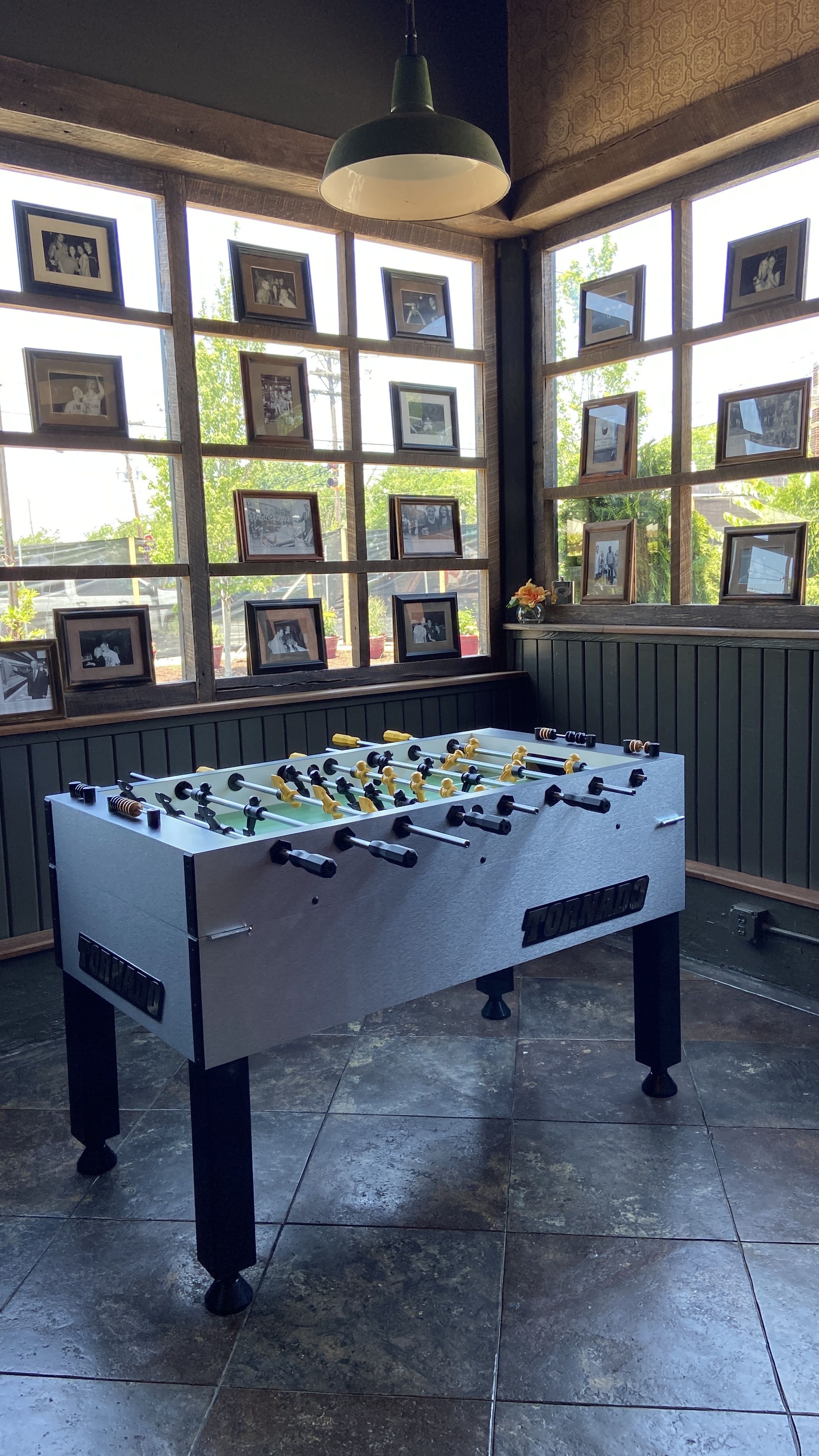 A foosball table and old photos. 