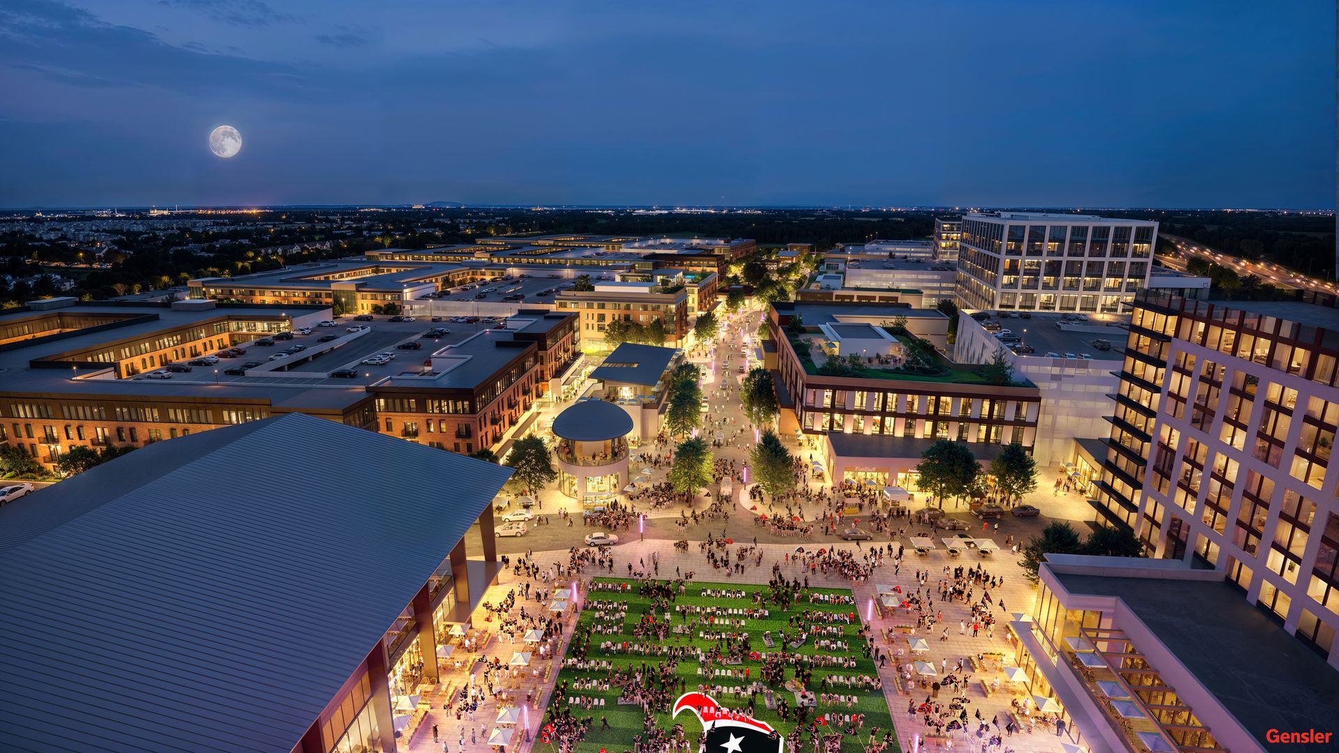 Aerial night view of a lively urban plaza with many people, green spaces, and modern buildings lit with warm lights, under a dark blue sky with a full moon.