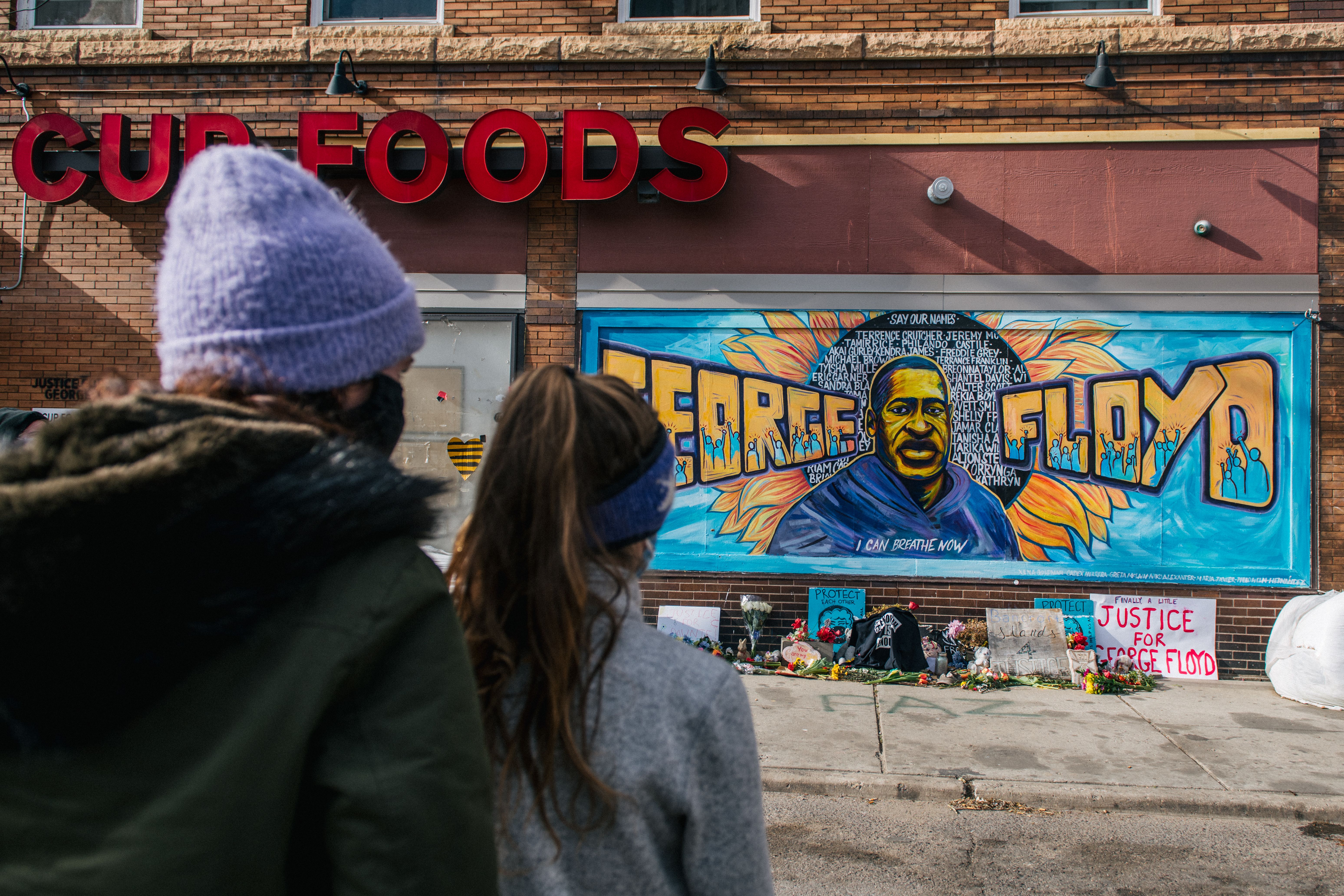 people look at George Floyd mural