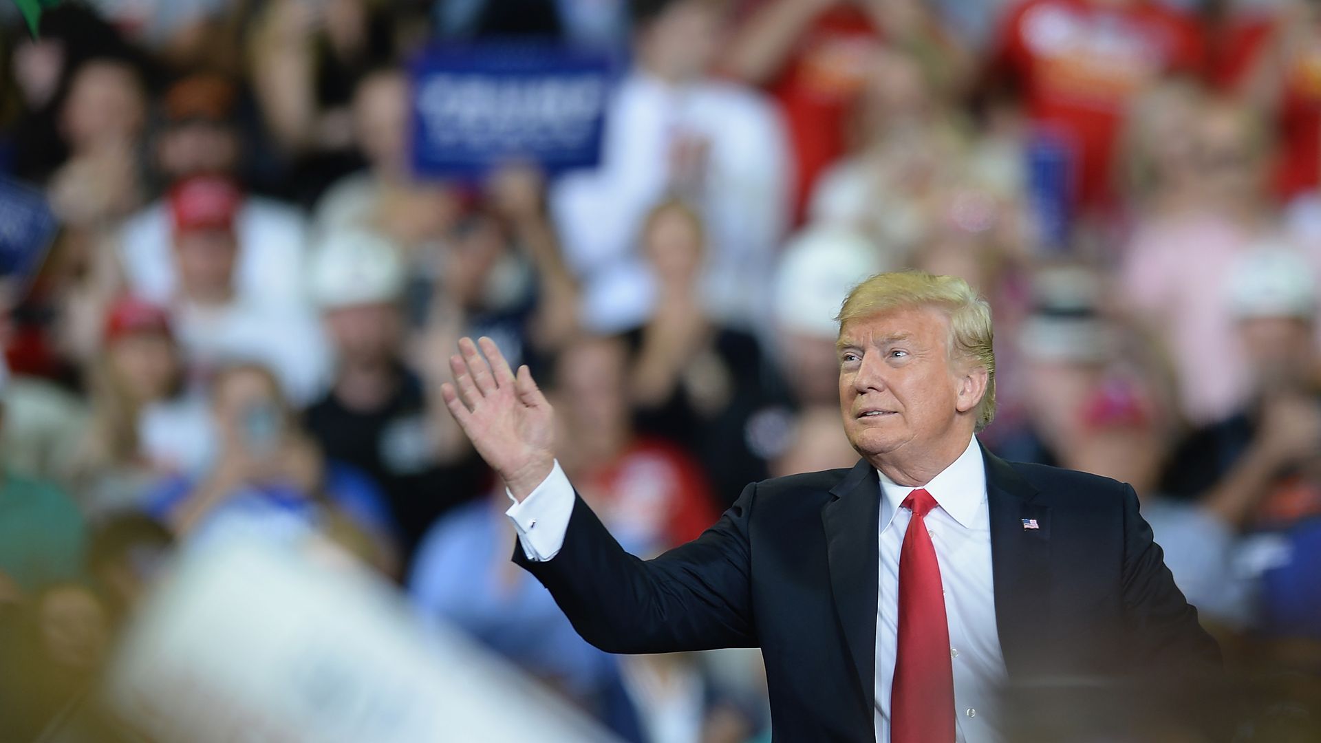 President Donald Trump after throwing a hat to a crowd.