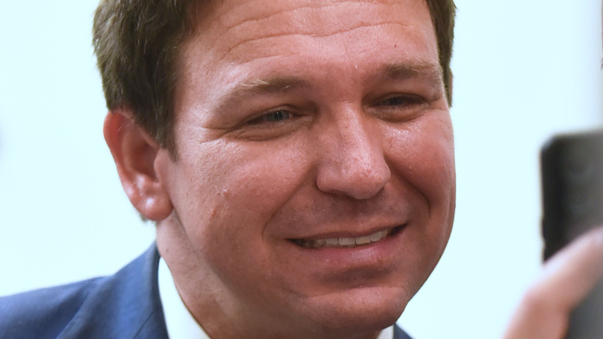 A close-up of Florida Gov. Ron DeSantis, smiling