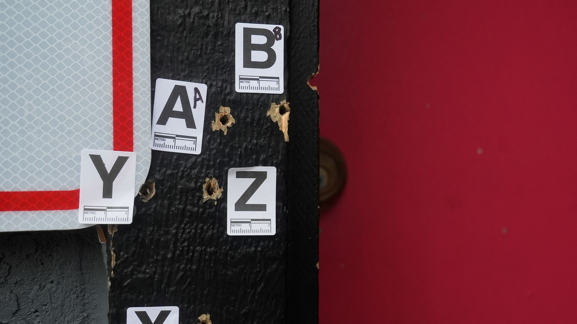 Bullet holes are shown where a mass shooting took place Saturday at a banquet hall in Stockton, Calif., Monday, Dec. 1, 2025. (AP Photo/Jeff Chiu)
