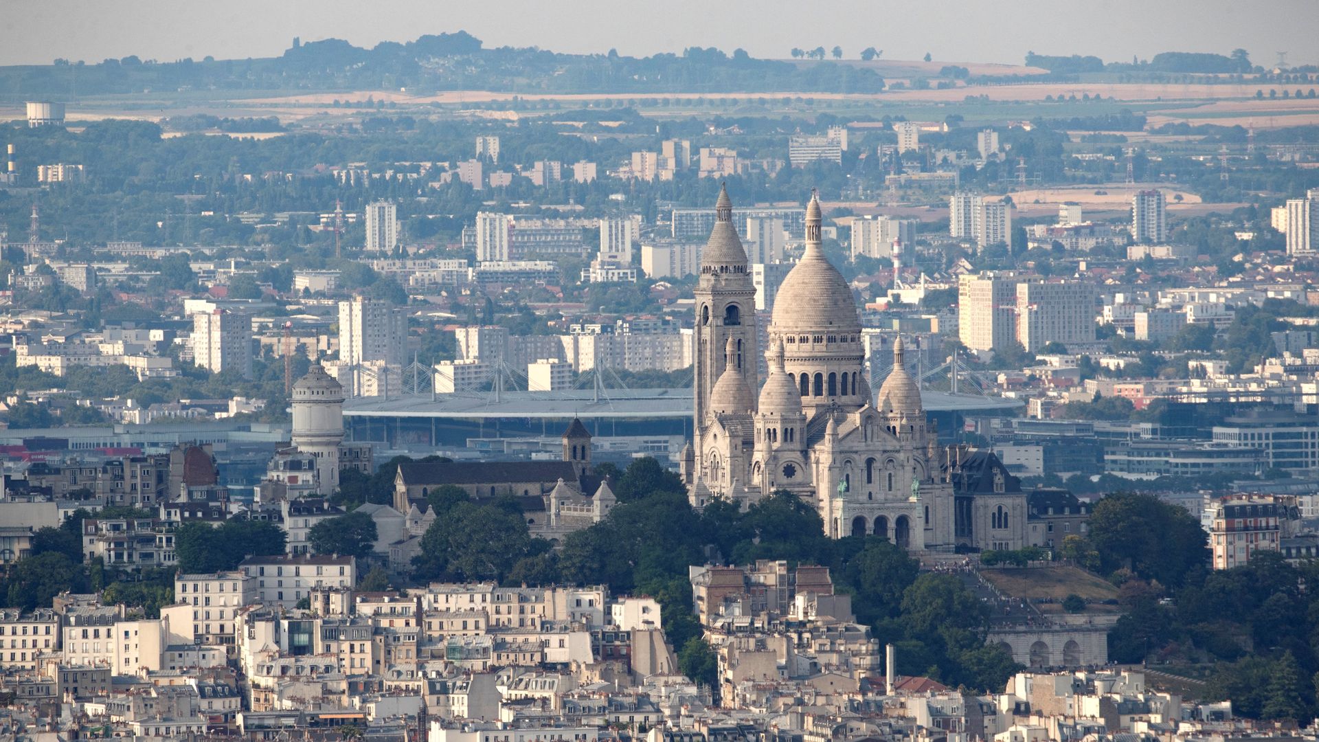 This picture taken on July 15, 2018, from the panoramic observatory of the Montparnasse Tower (Tour Montparnasse) in Paris, shows the Sacre-Coeur Cathedrale and Montmartre. (Photo by Thomas SAMSON / AFP) (Photo by THOMAS SAMSON/AFP via Getty Images)