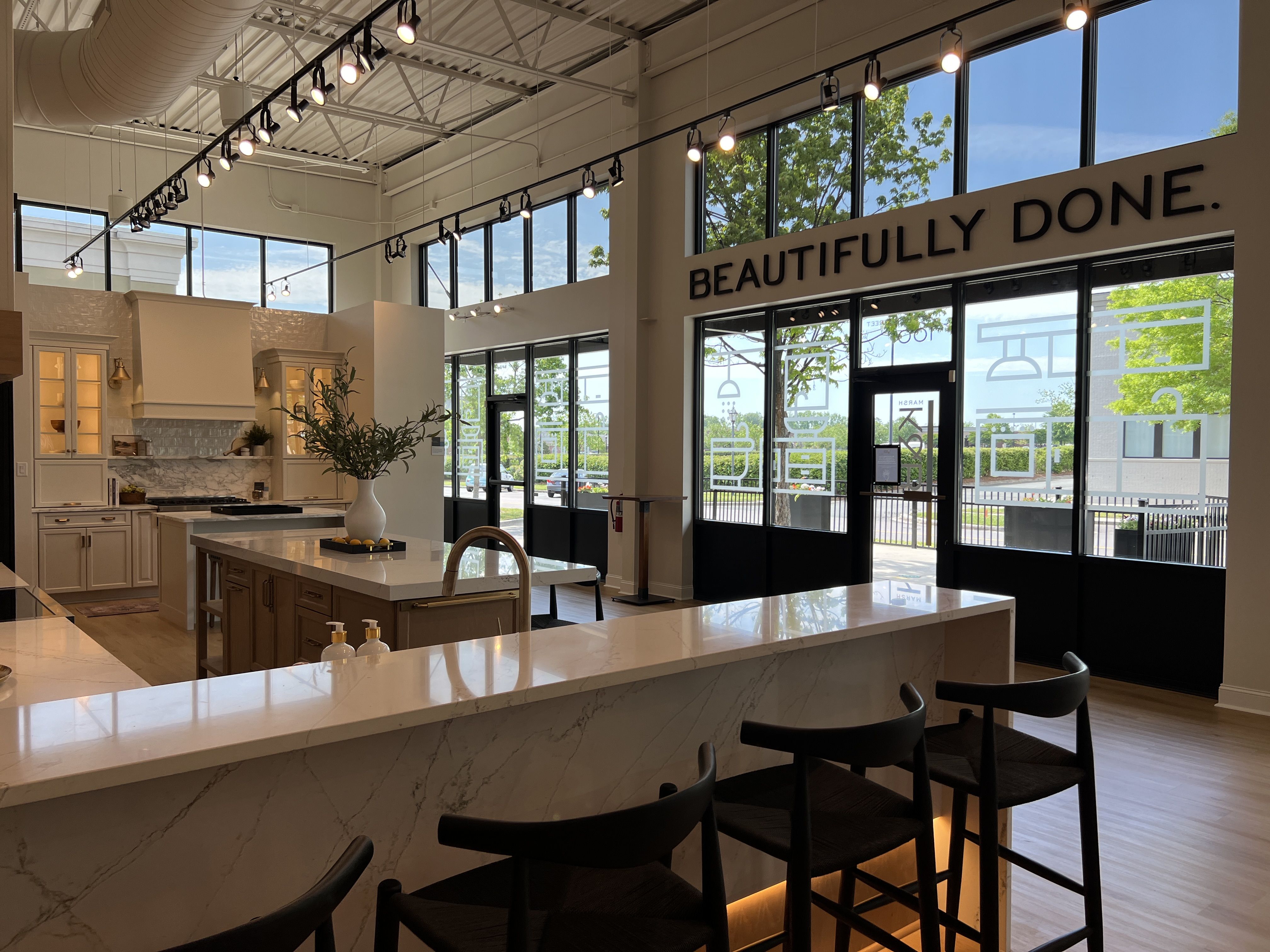 A showroom of a kitchen and dining area.