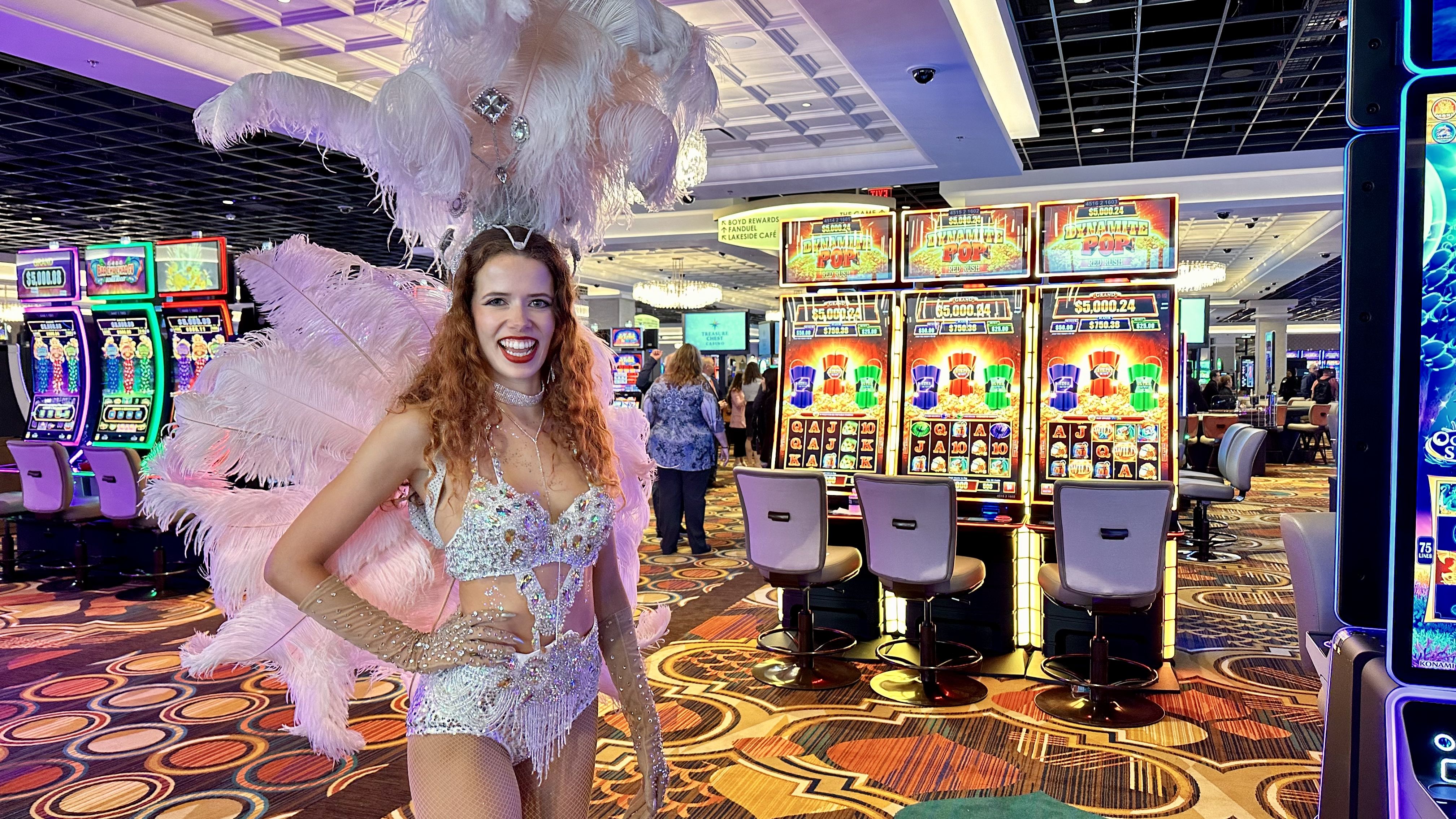 Photo shows a showgirl with a feathered headdress.