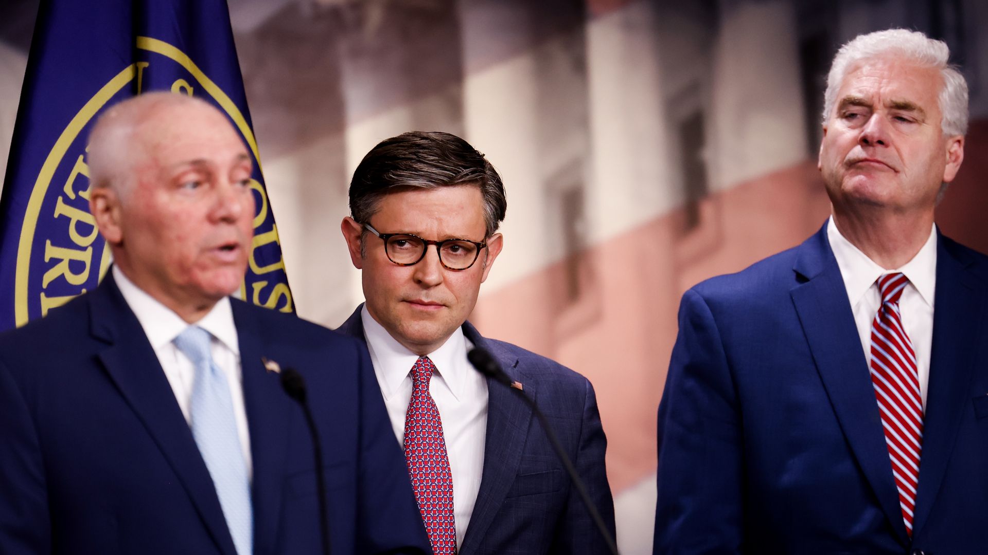 Reps. Steve Scalise, Mike Johnson and Tom Emmer, wearing blue suits with white shirts and standing in front of a Capitol backdrop.
