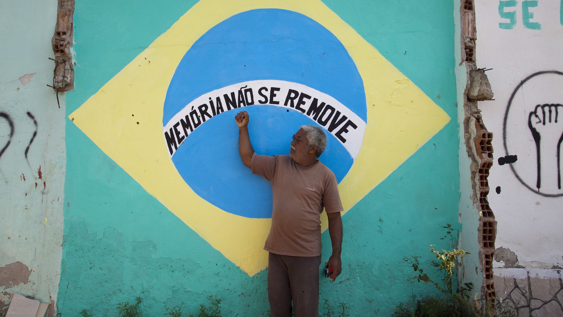 Brazil resident in front of mural