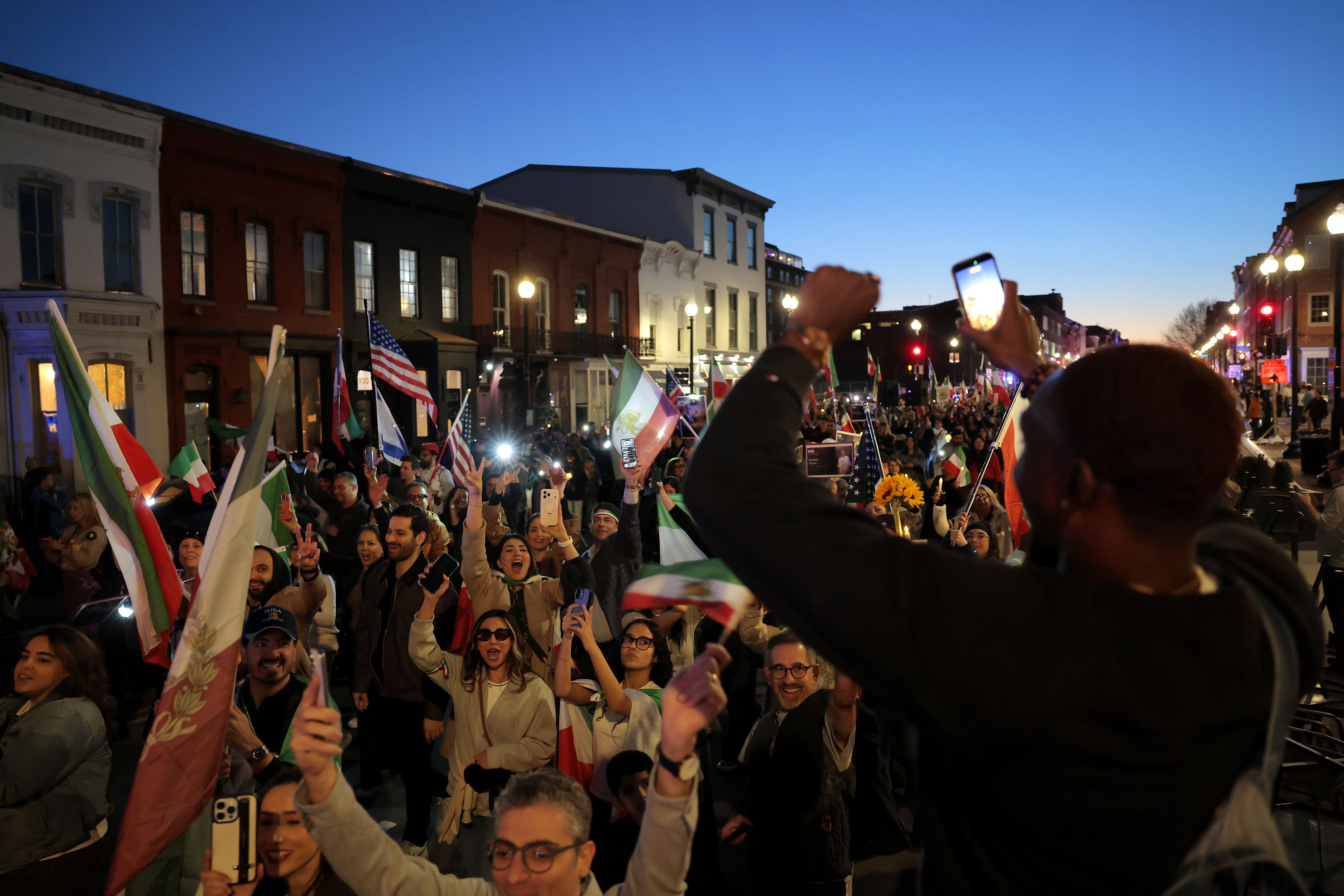  Members of the Iranian-American community and supporters celebrate on February 28, 2026 in Washington, DC. President Donald Trump announced that the United States and Israel had launched an attack on Iran Saturday morning. (Photo by Heather Diehl/Getty Images)