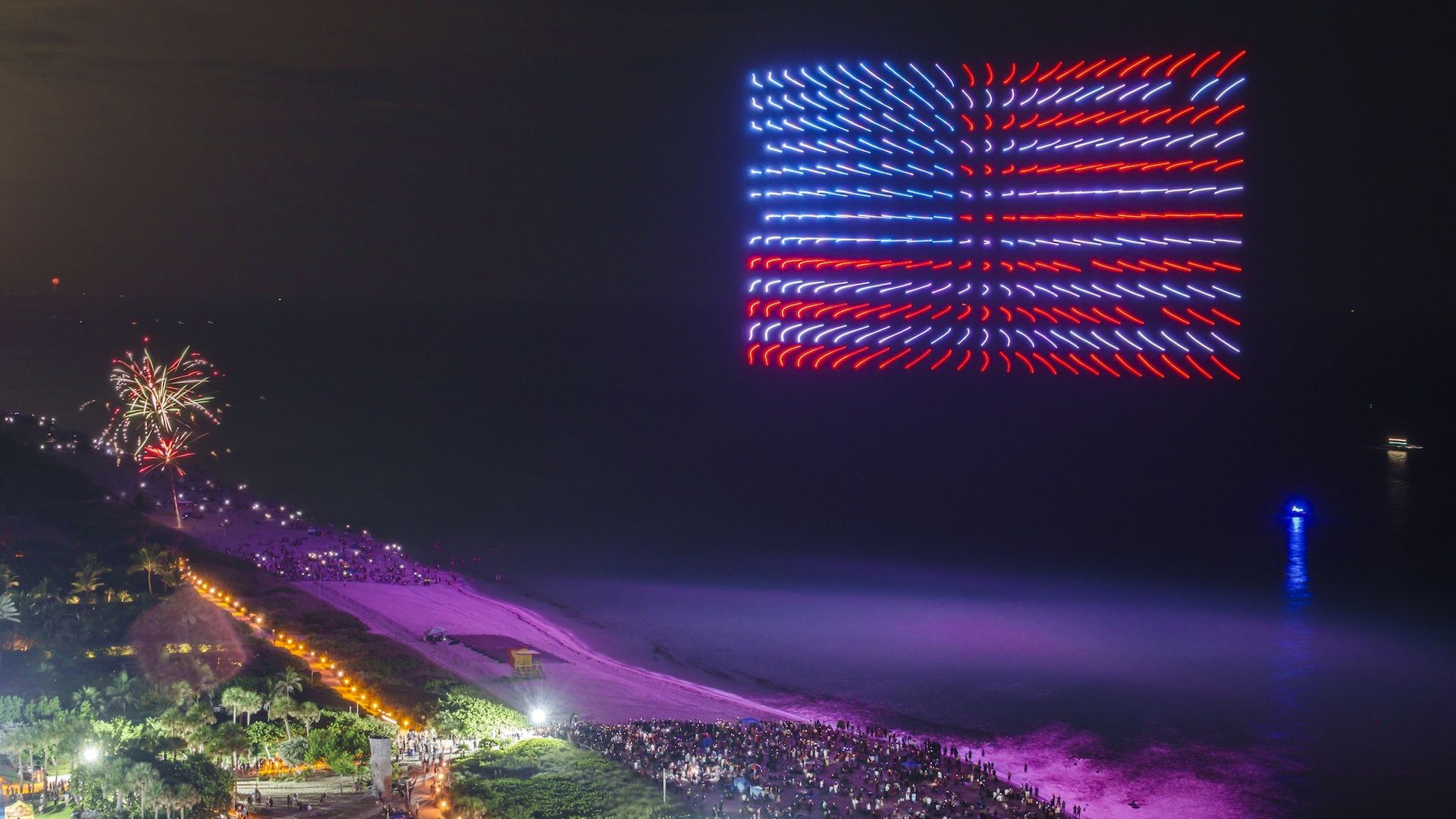 Drones forming an American flag in the sky above Miami.