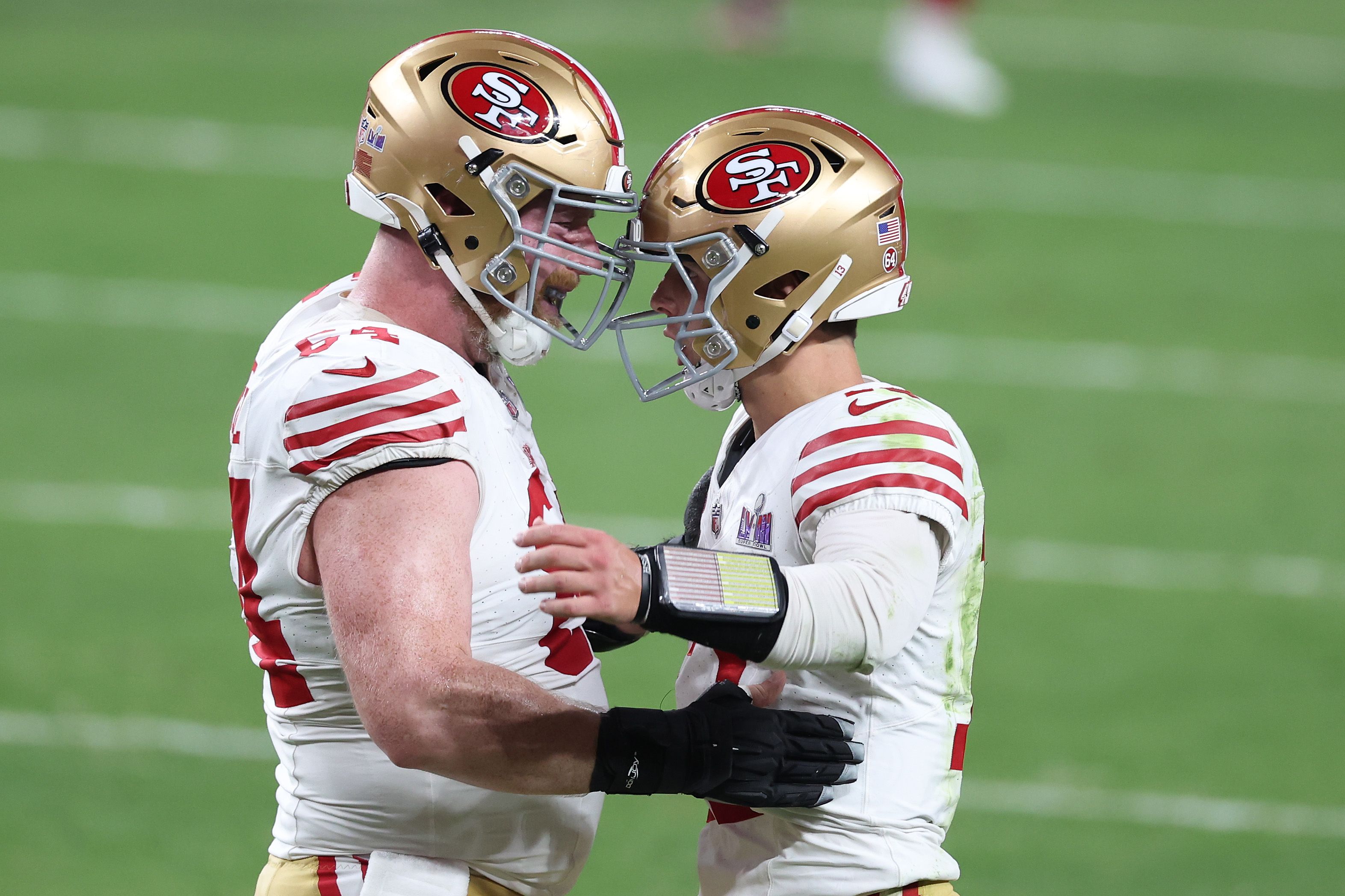 Brock Purdy #13 of the San Francisco 49ers celebrates with Jake Brendel #64 after throwing a pass for a touchdown in the fourth quarter against the Kansas City Chiefs during Super Bowl LVIII at Allegiant Stadium on February 11, 2024 in Las Vegas, Nevada. 