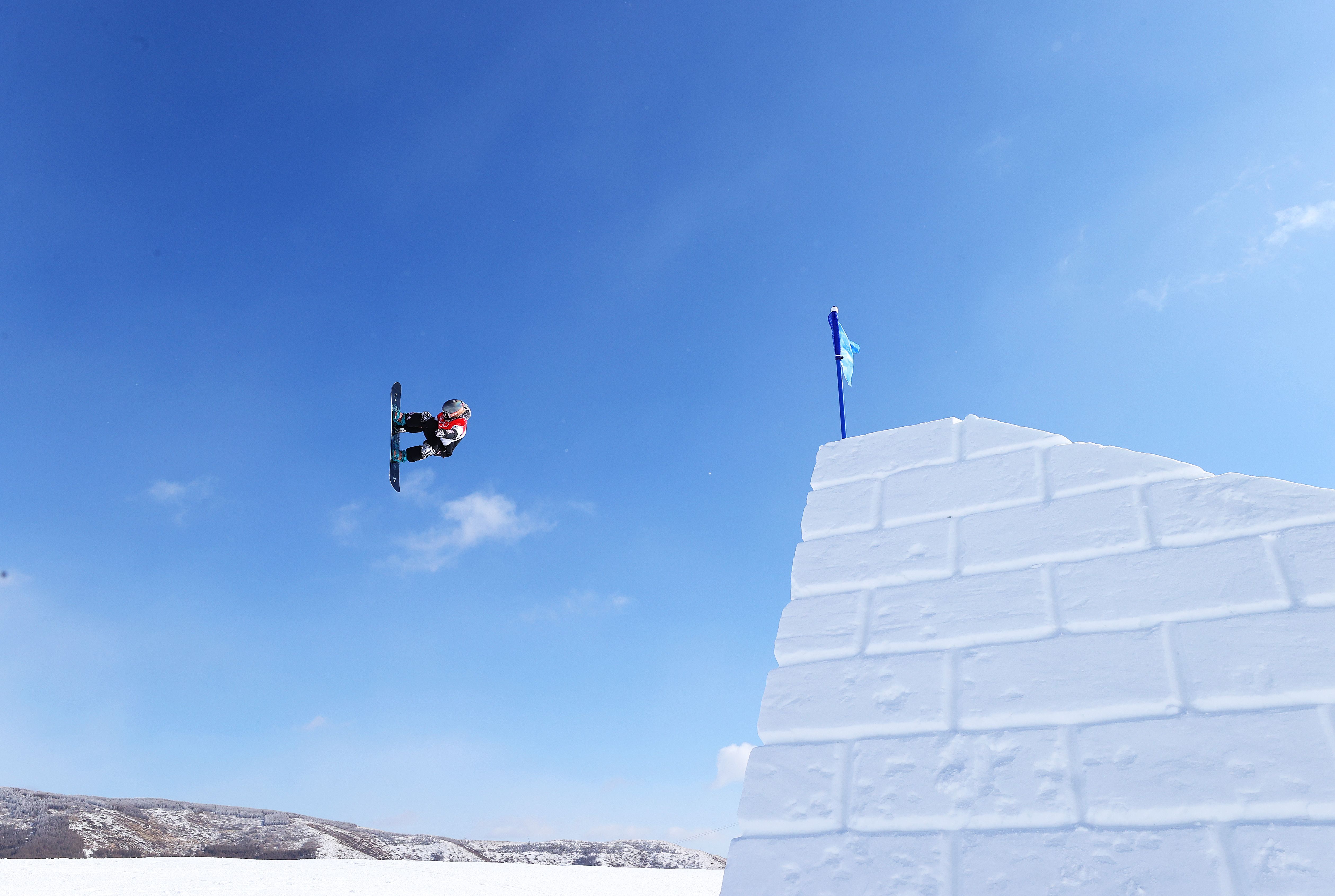 Jamie Anderson of Team USA performs a trick during the Snowboard Slopestyle Training session ahead of the Winter Olympic Games at the Genting Snow Park on February 04, 2022 in Zhangjiakou, China. 