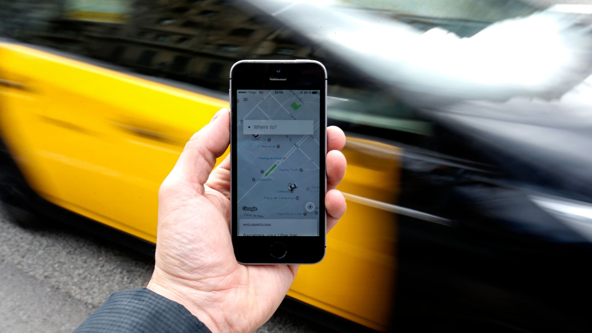 A iPhone user on the Uber app