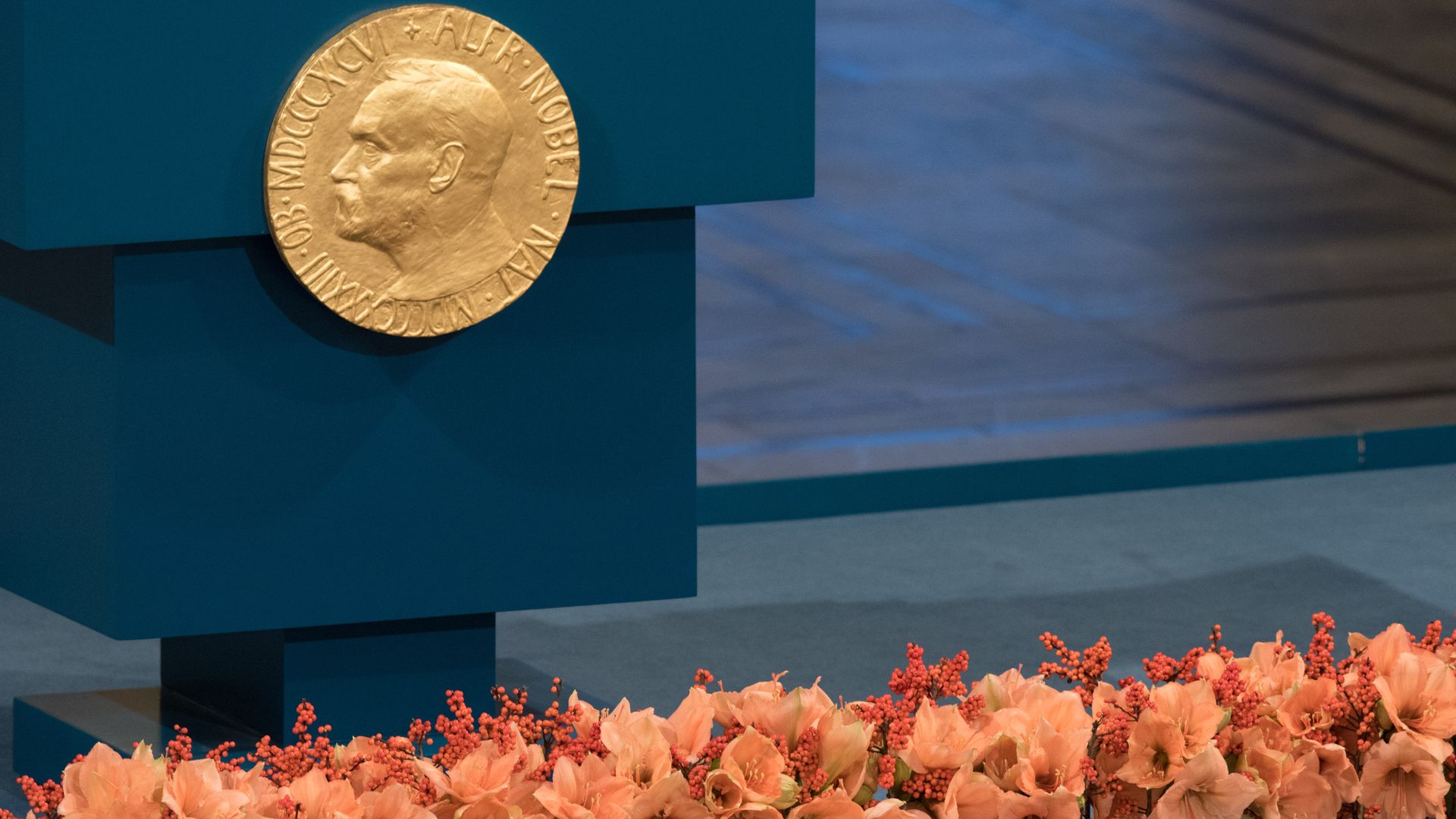 A plaque depicting Alfred Nobel adorns the lecturn prior to 2015 ceremony in Oslo, Norway.