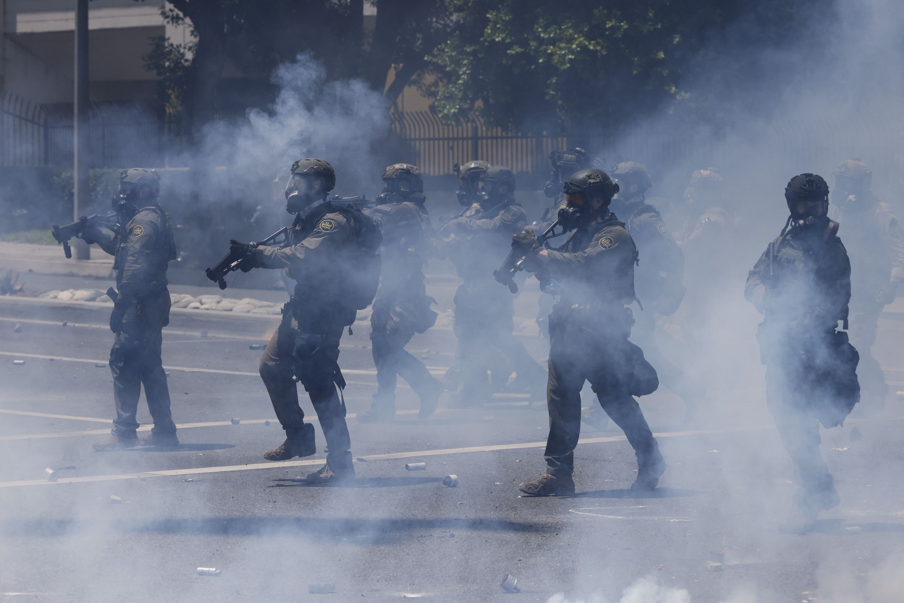 ICE officers disperse tear gas during protests in Los Angeles