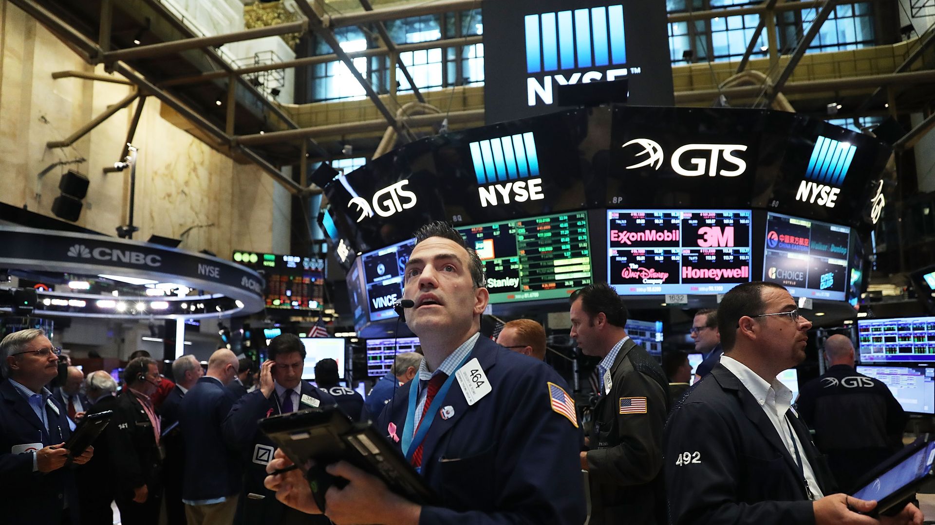 A group of traders on the stock exchange floor.