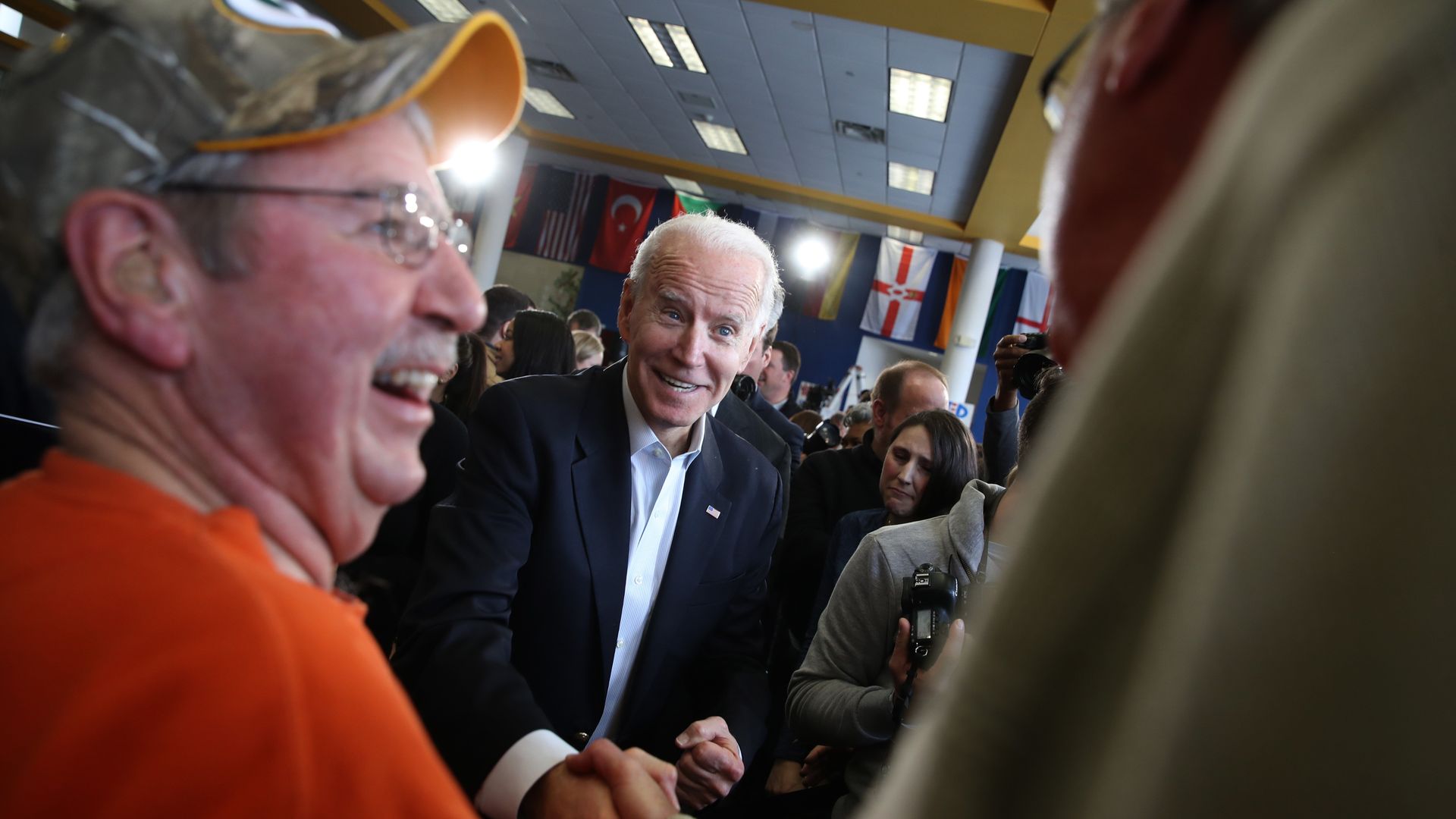 Joe Biden shakes a voter's hand.