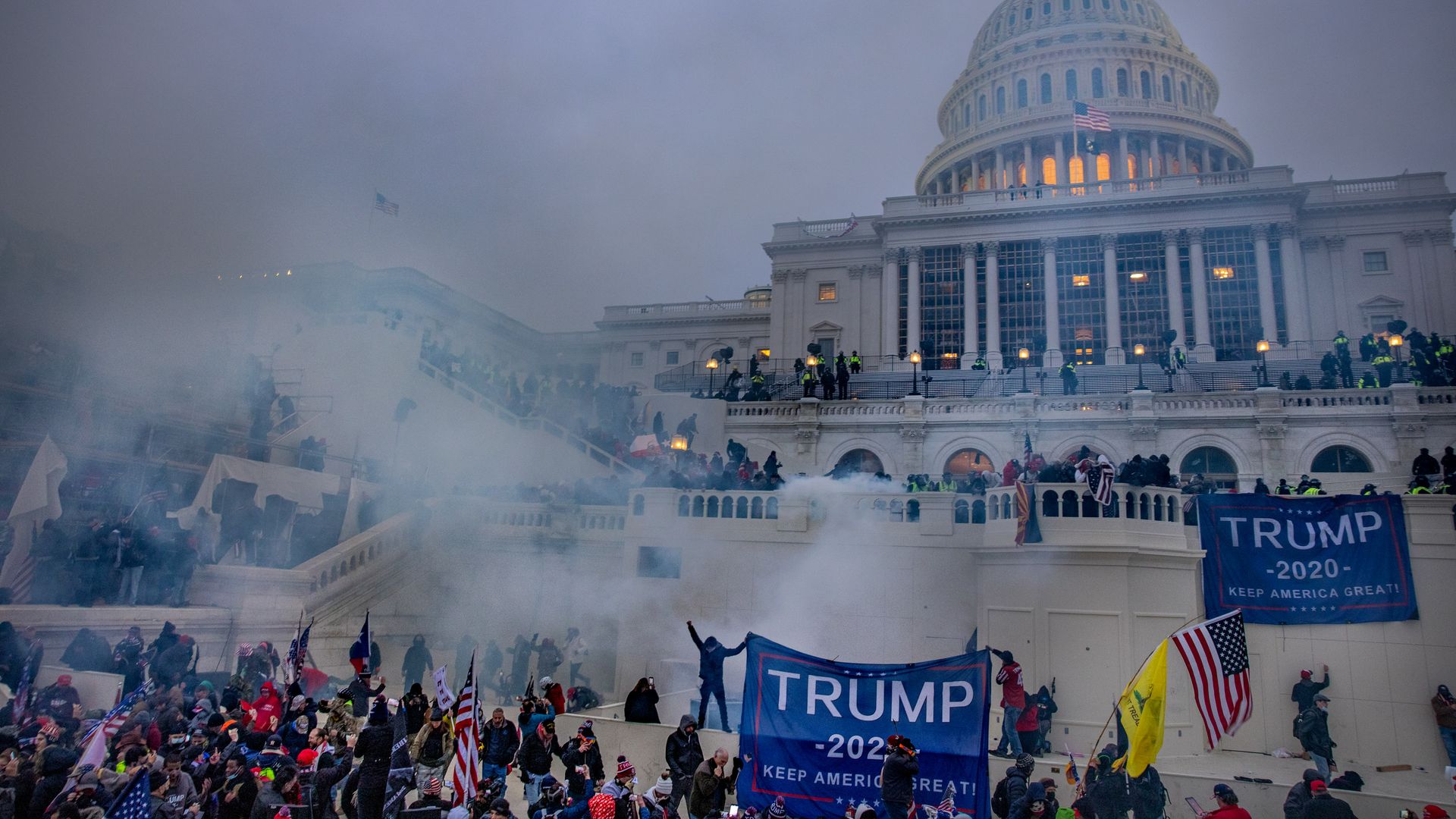 Photo of tear gas in the air as Trump supporters clash with law enforcement at the Capitol complex