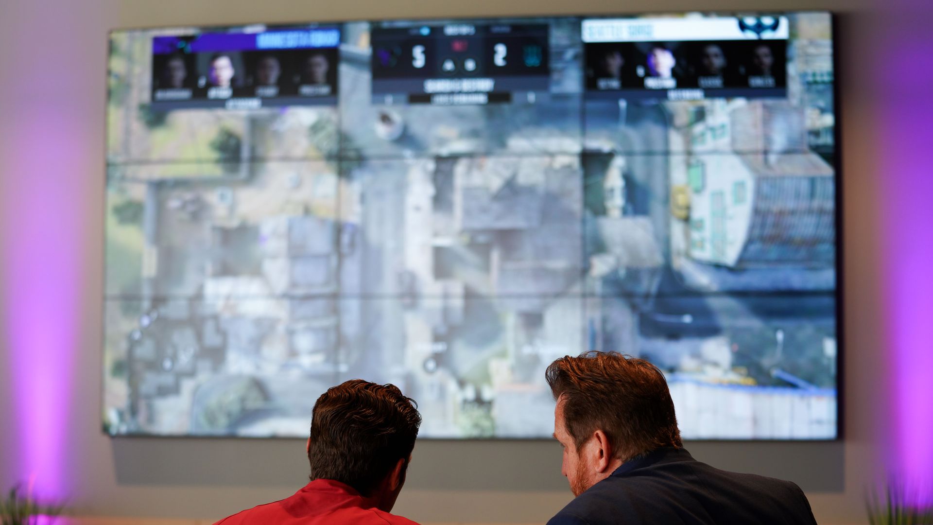 Minnesota ROKKR team members watch the team's latest game.